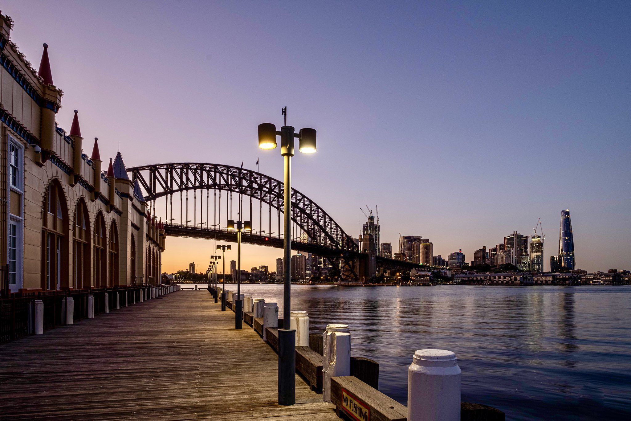 2048x1366 tim ritchie the boardwalk next to Sydney's Luna Park with dawn on the harbour and city, I think back to the days of terror and delight on the rotor