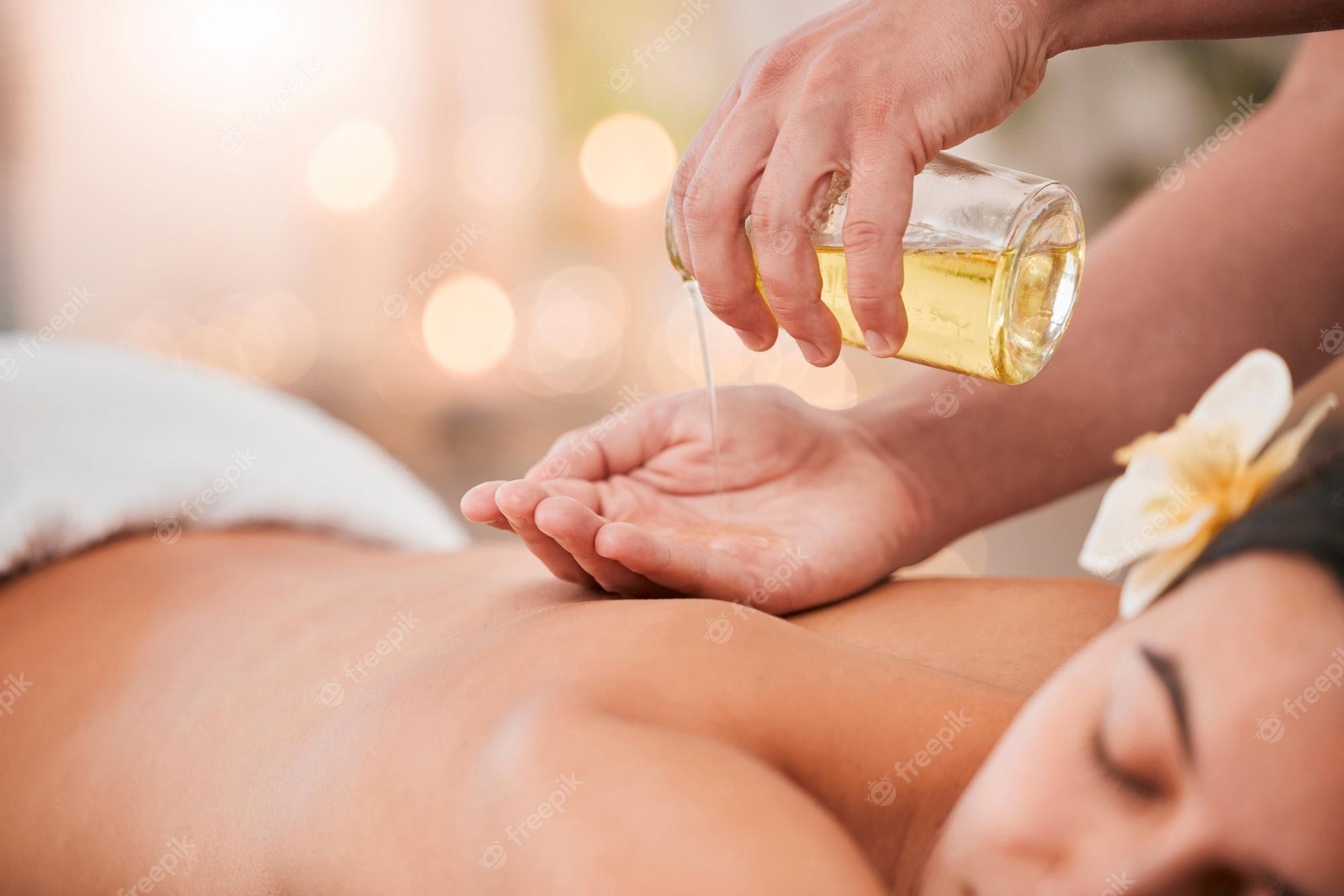 2000x1334 Premium Photo. Hand oil and massage on woman at a spa for wellness relax and stress relief with back massage and masseuse luxury back and girl hands of therapist with product