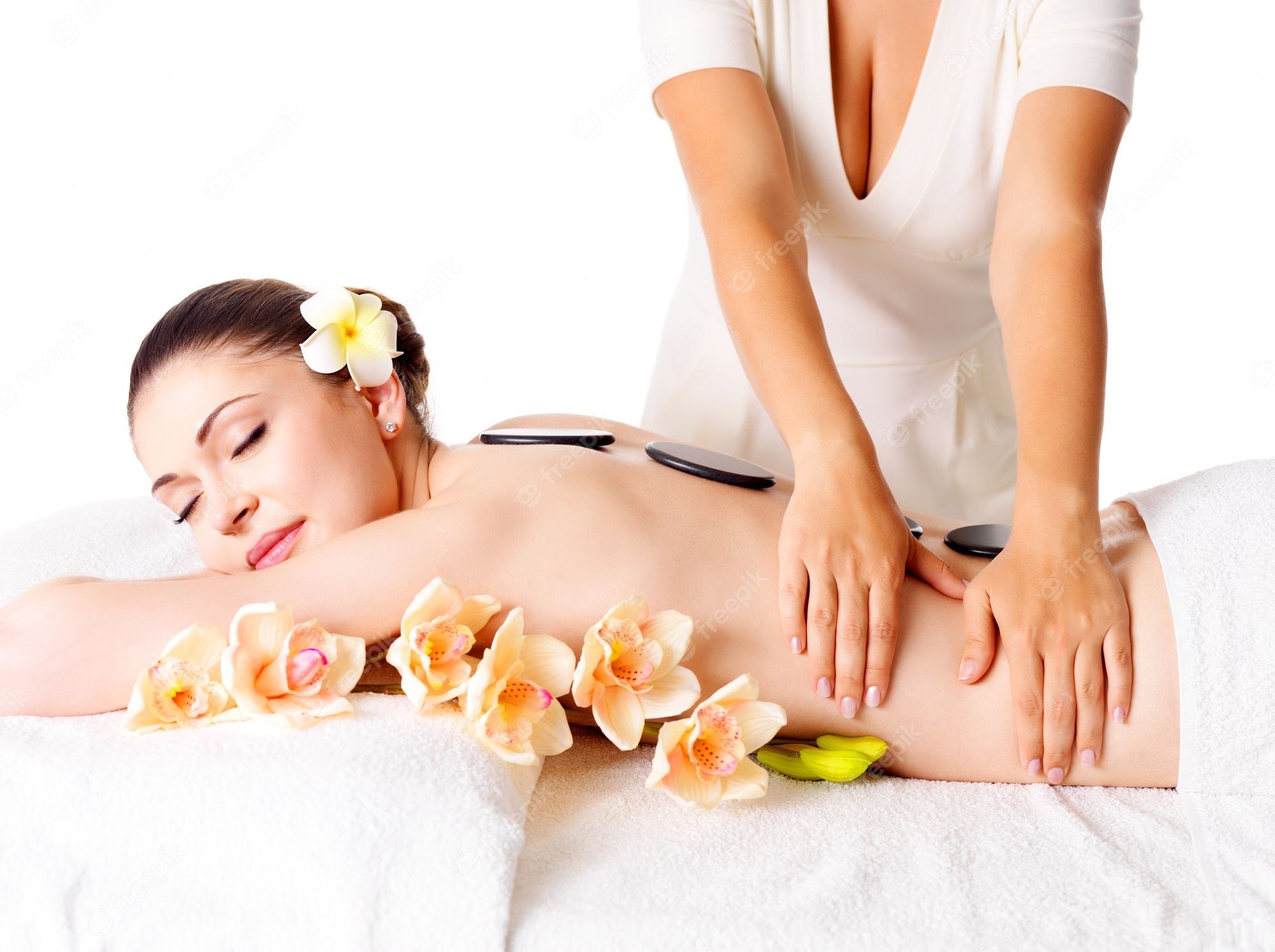 2000x1494 Free Photo. Woman having massage of body in the spa salon. beauty treatment concept