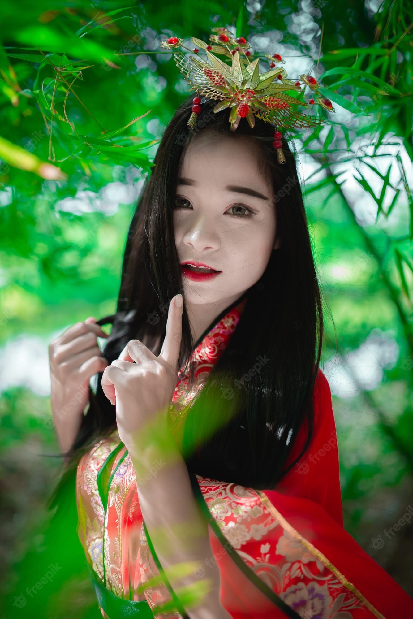 1335x2000 Premium Photo. Portrait of beautiful asian woman wear ancient chinese dress style at the bamboo forestthailand peoplechinese movie scene