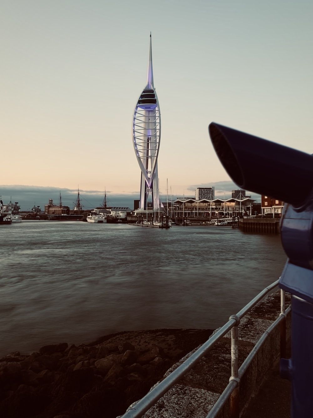 1000x1334 A tall tower by the water photo