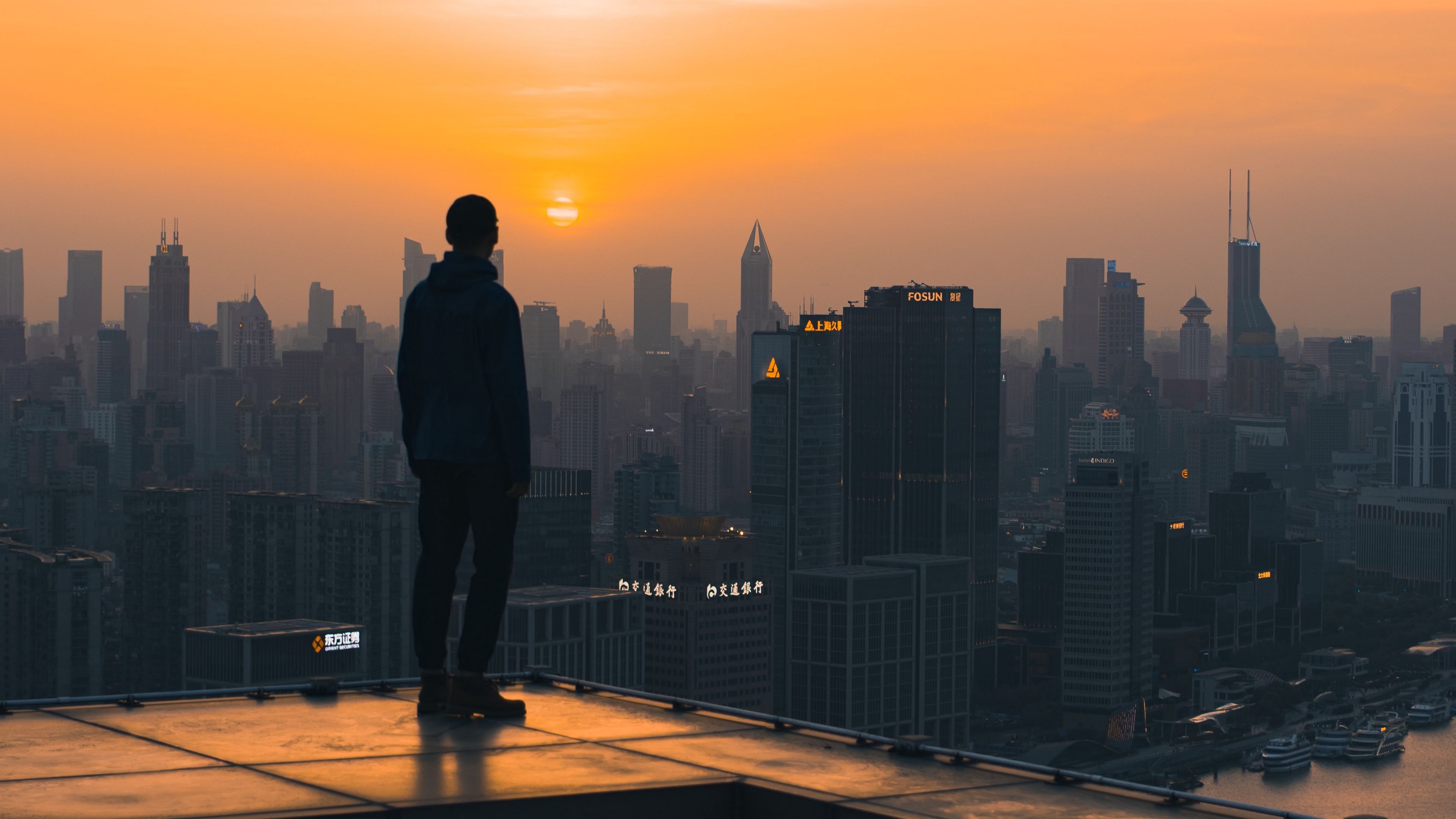3840x2160 Wallpaper / roof, man, city, sunset, buildings, overview, 4k free download