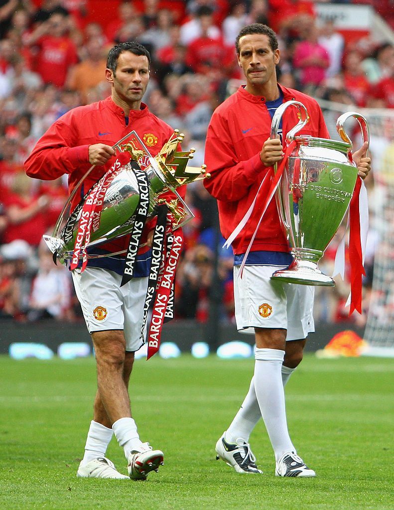 791x1024 Rio Ferdinand of Manchester United and team mate Ryan Giggs show off.. Manchester united champions league, Manchester united champions, Manchester united legends