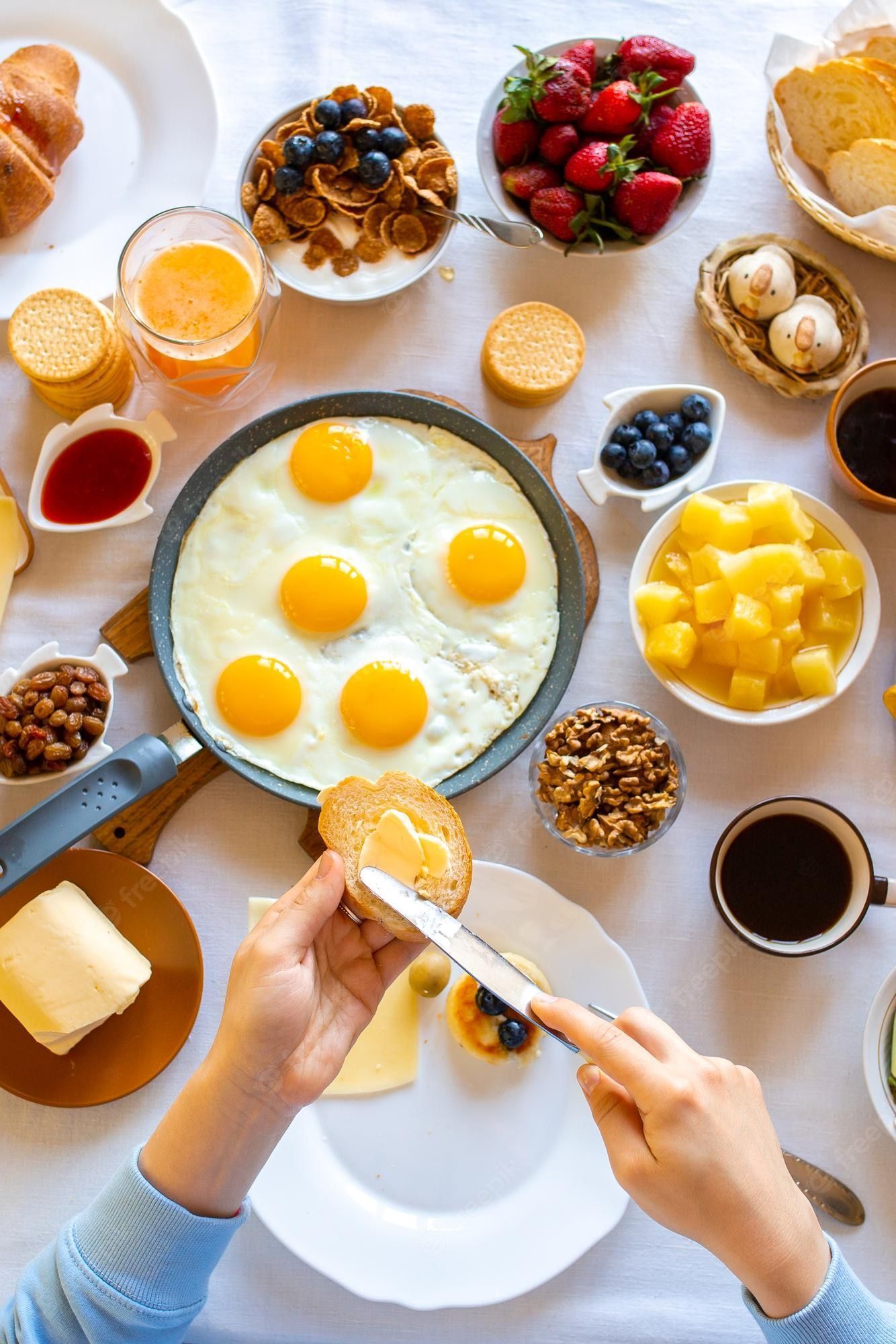 1334x2000 Premium Photo. Bread and butter for breakfast eggs on the table beautiful breakfast food day dinner