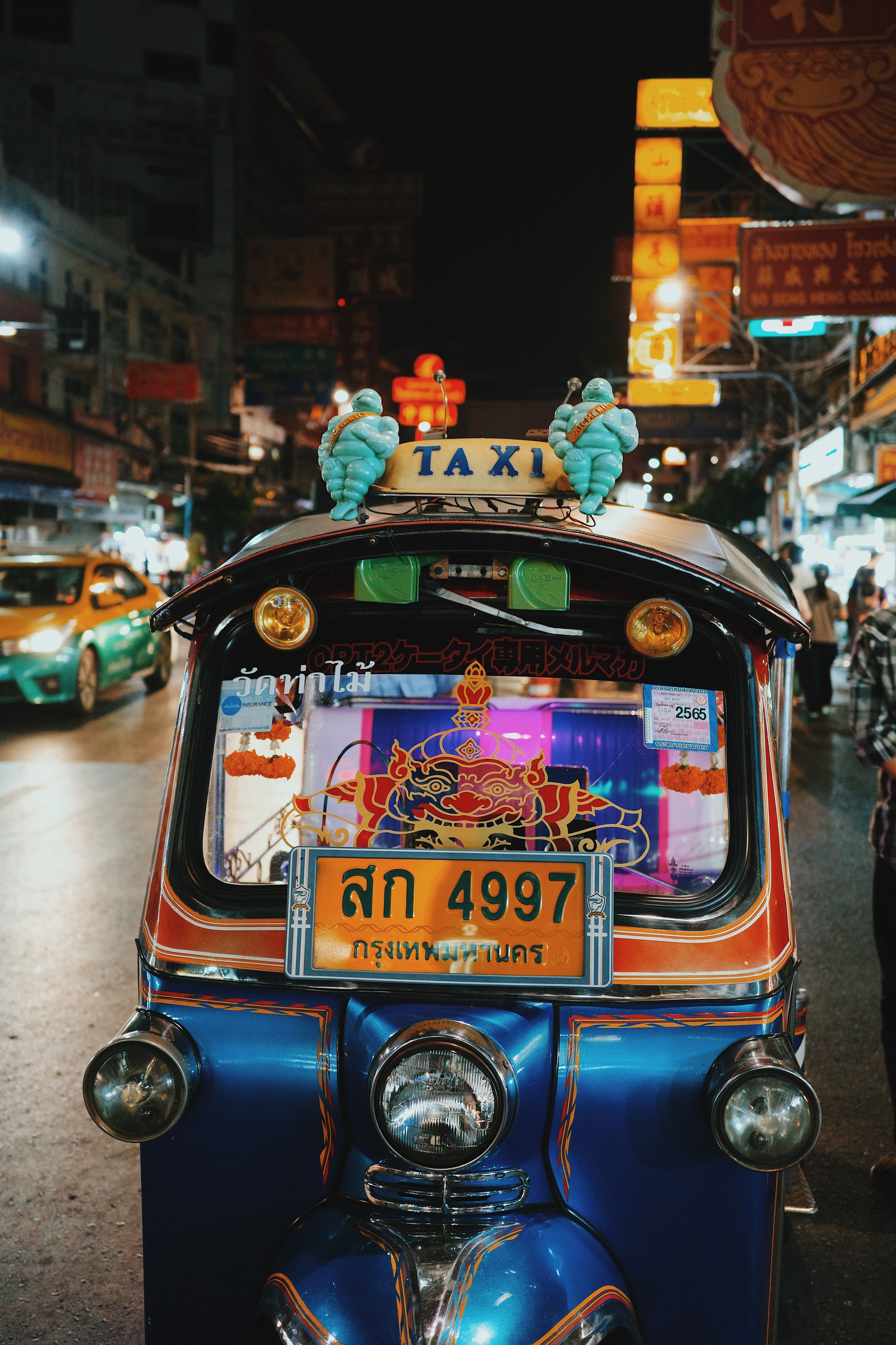 4000x6000 A Person Riding an Auto Rickshaw on the Road · Free