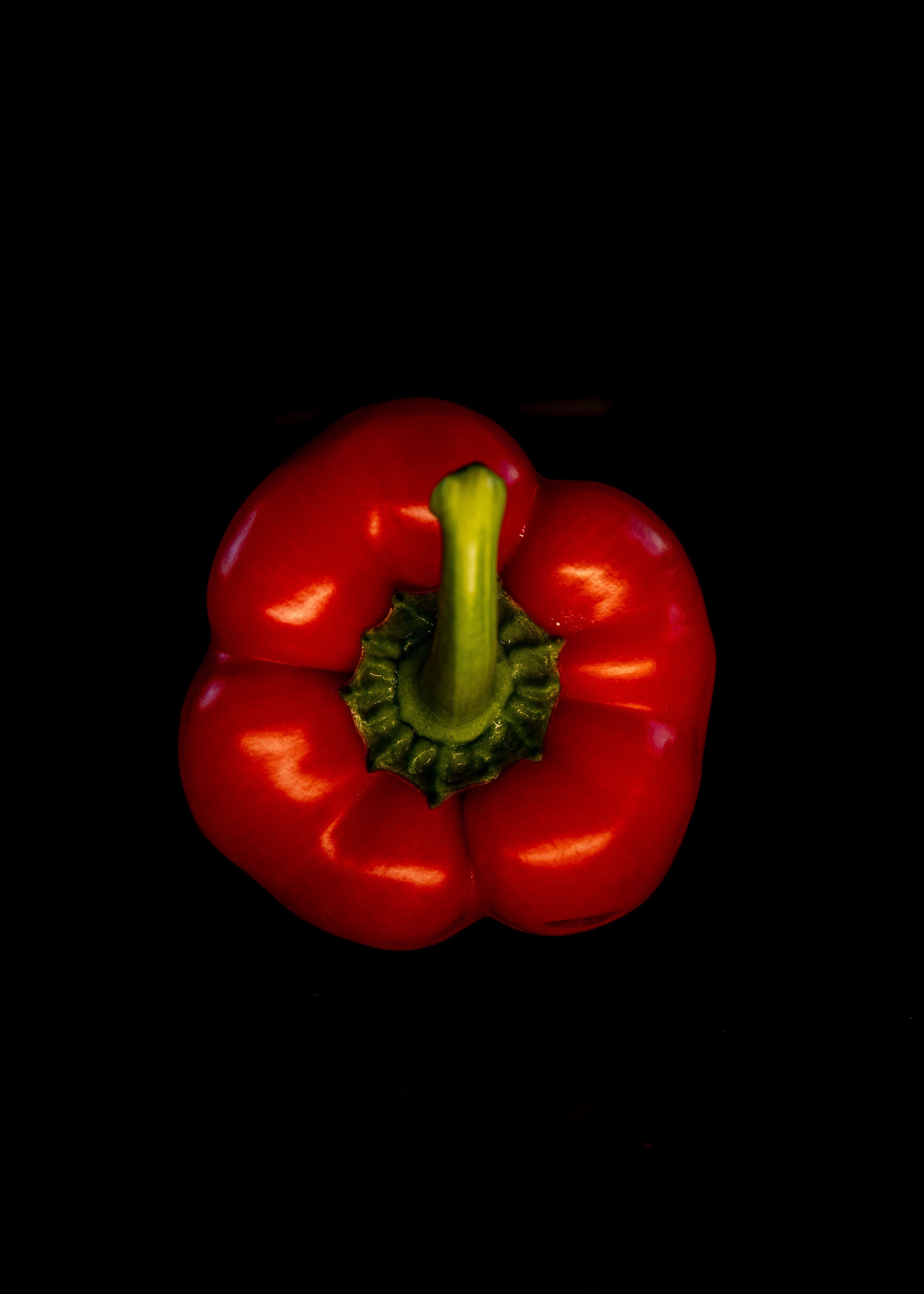 3221x4510 Three Red Bell Peppers on Red Surface · Free