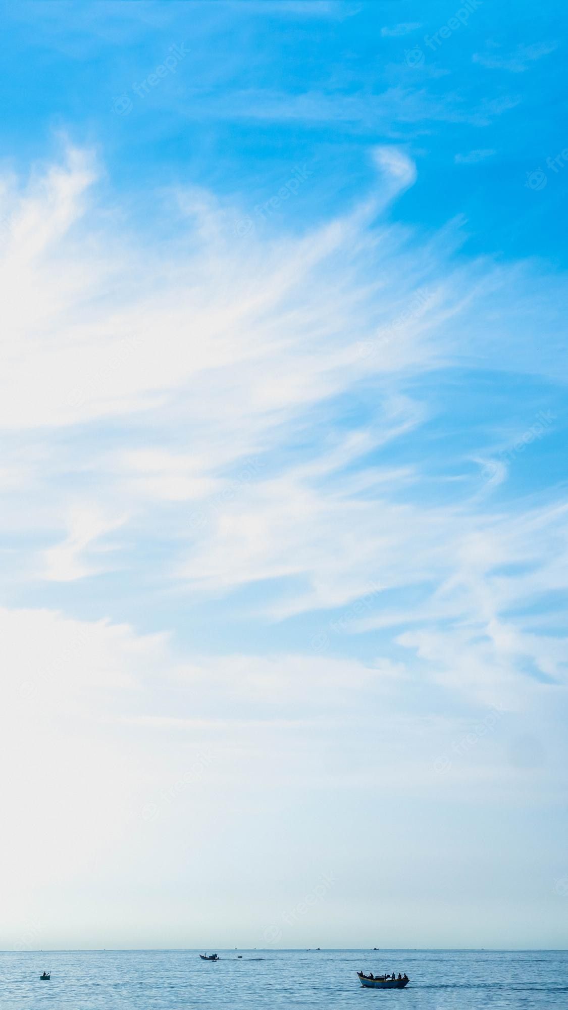 1125x2000 Premium Photo. Banner vertical story atmosphere panorama white cloud clear blue sky horizon line calm empty sea concept paradise life design relax wallpaper background more tone format in stock