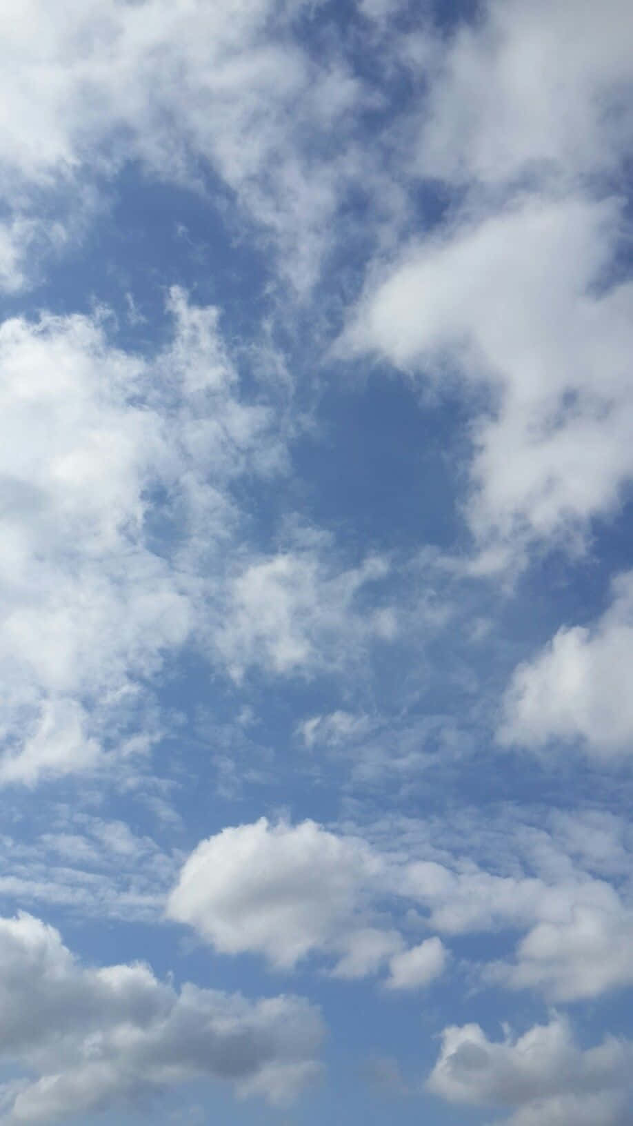 918x1632 Download Admire the beauty of a clear blue sky Wallpaper