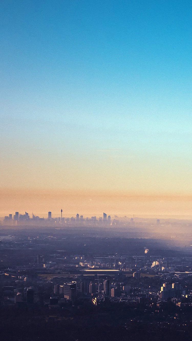 750x1333 Clear Blue Sky Morning Mist Over City Metropolis iPhone Wallpaper