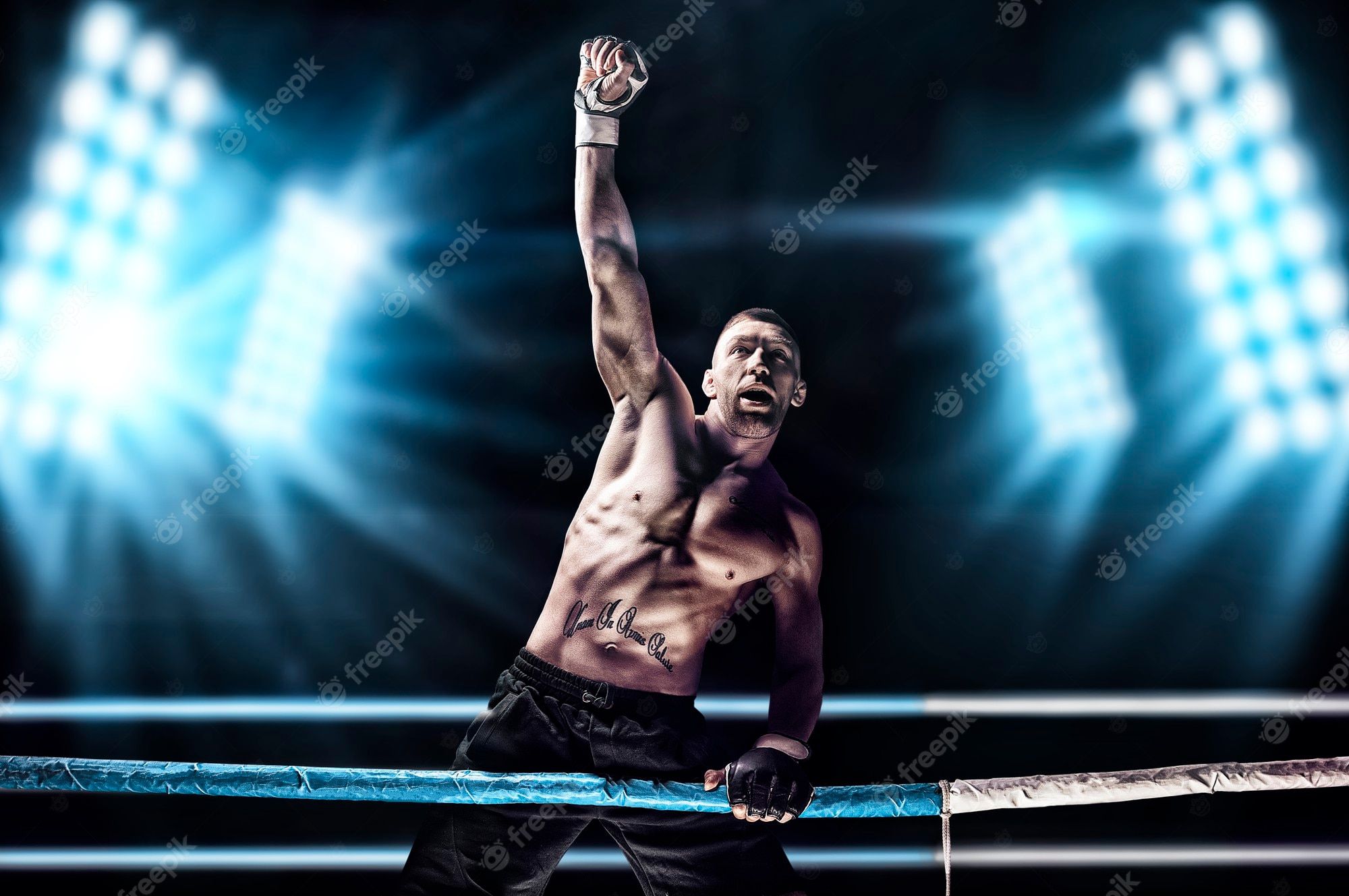 2000x1329 Premium Photo. Kickboxer posing in the ring. the athlete climbed the ropes and took a victorious position against the background of spotlights