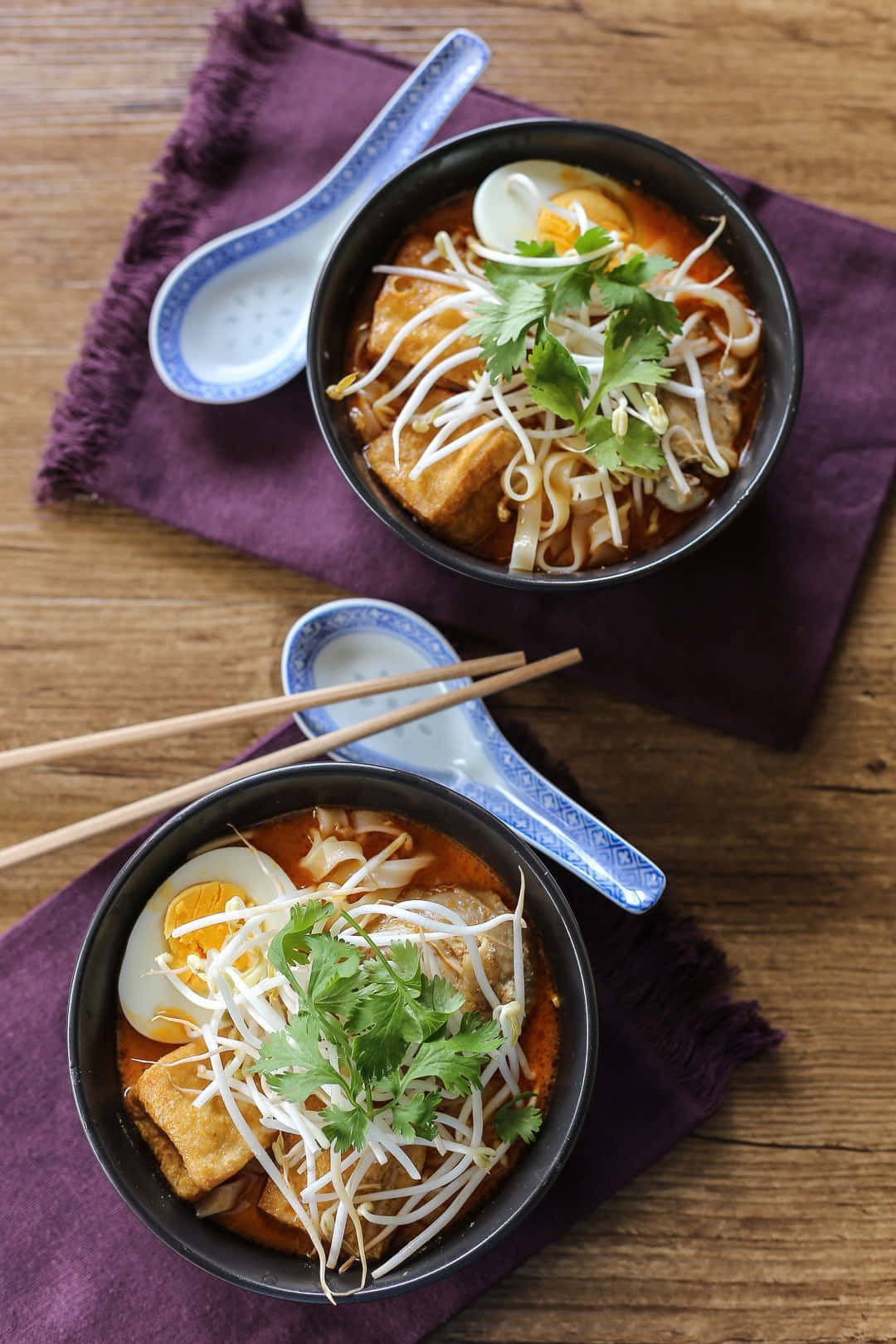 1080x1620 Download Chicken Curry Laksa On Purple Table Napkin Wallpaper