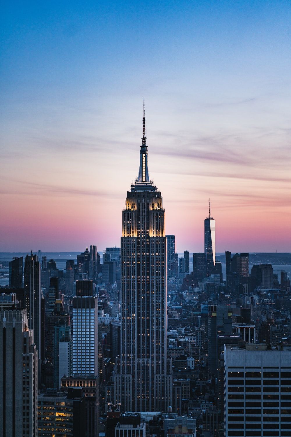 1000x1499 High rise buildings during sunset photo