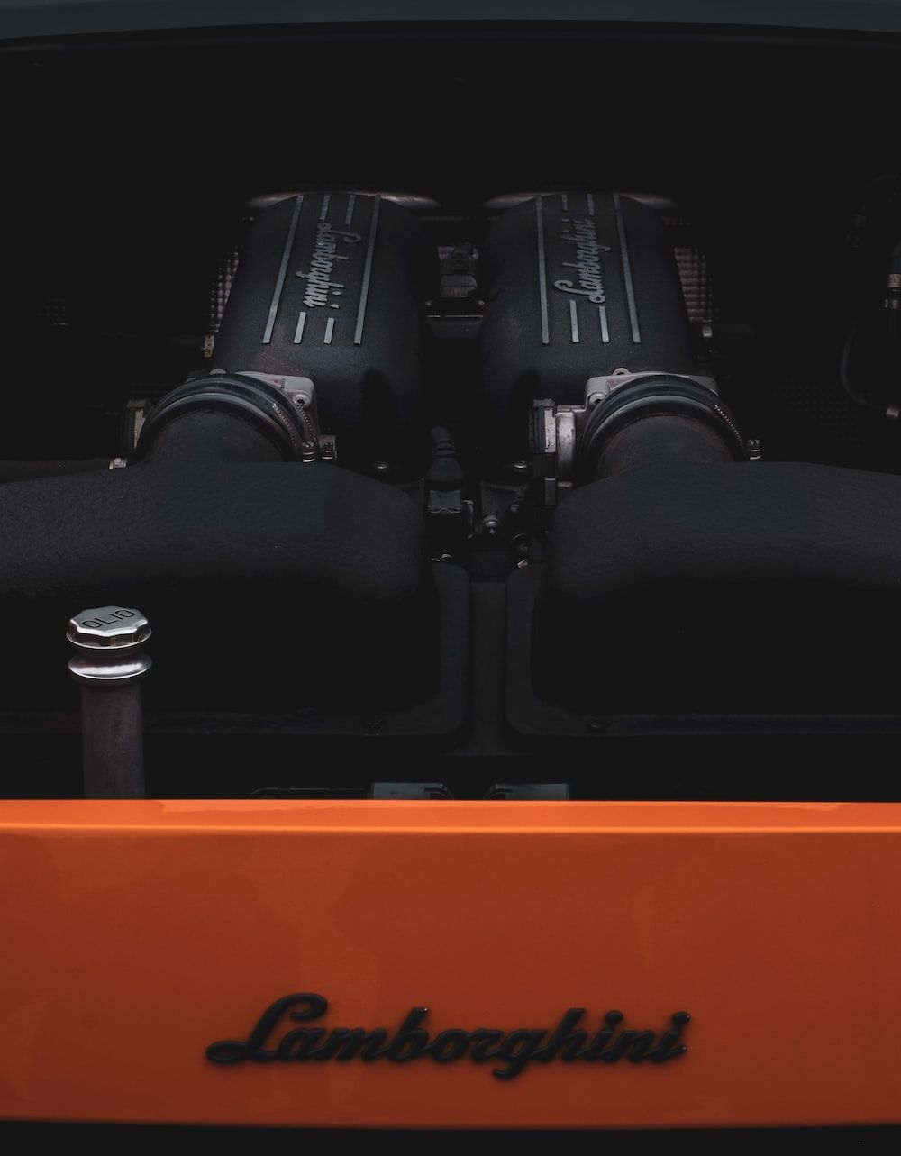 1000x1283 Black and orange machine part photo