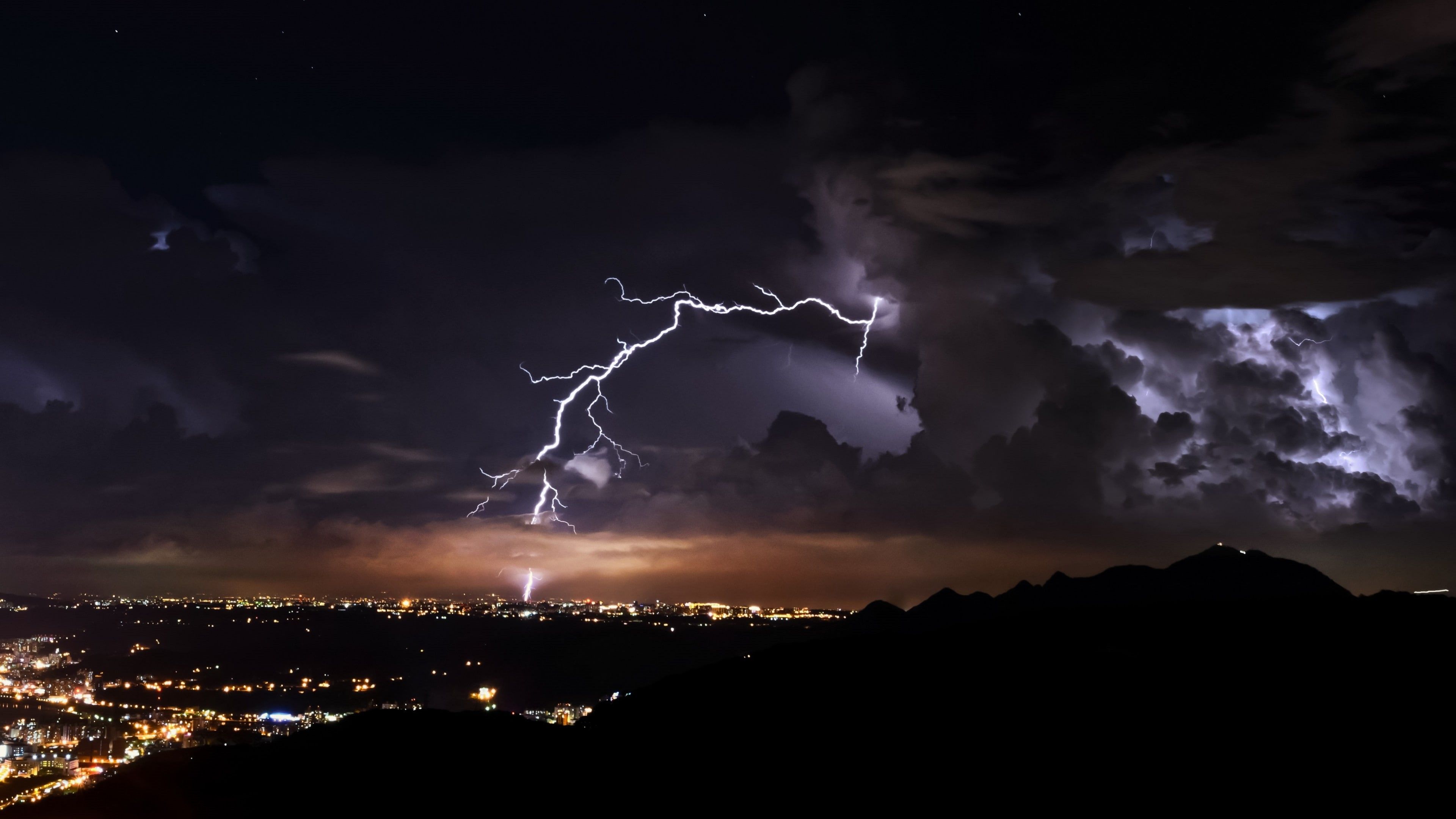 3840x2160 Wallpaper / evening, thunder, cloud, city lights, darkness, phenomenon, meteorological phenomenon, sky, thunderstorm, lightning, atmosphere, night, city, 4K, storm free download