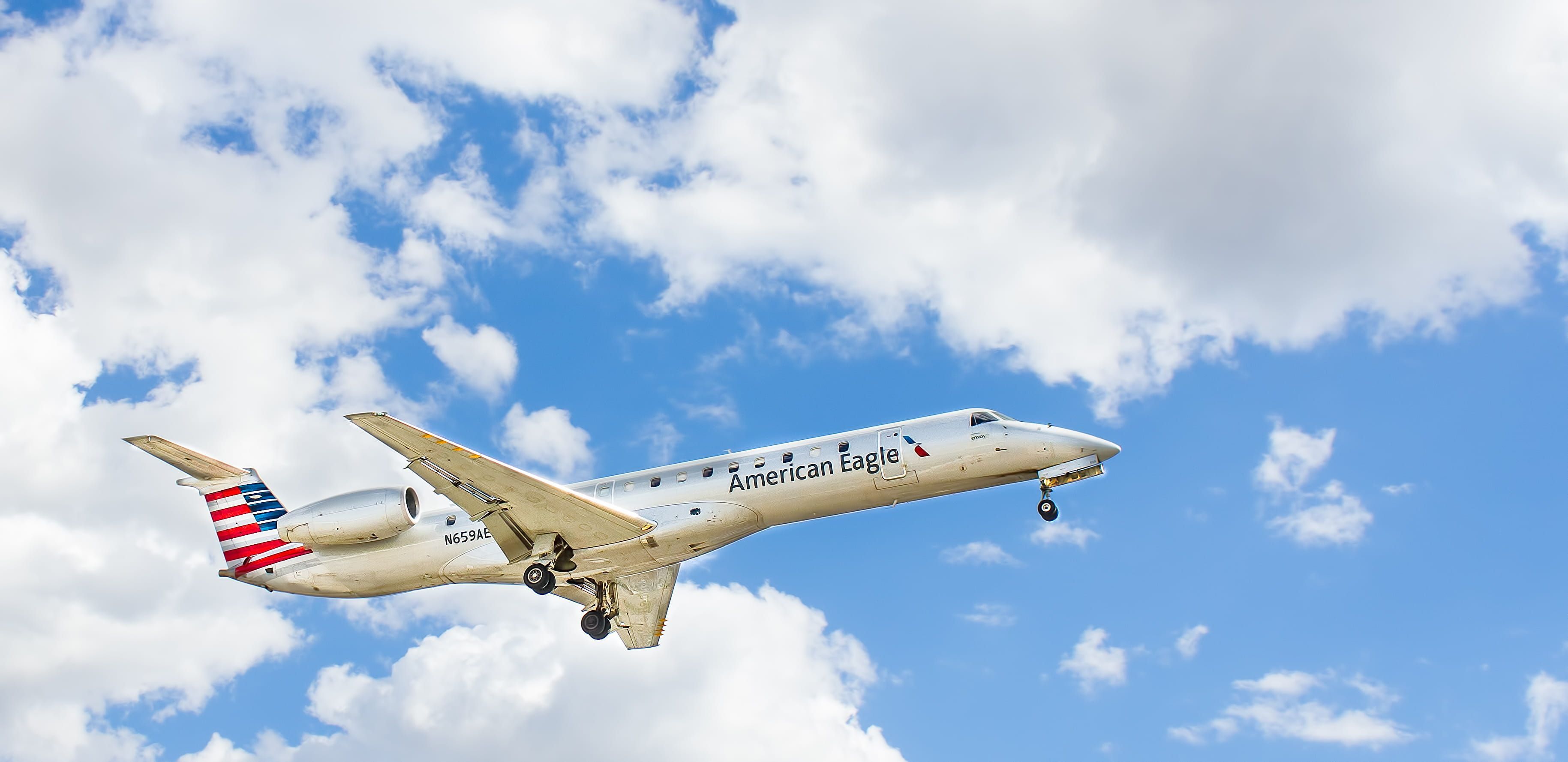 3658x1778 Wallpaper / mississauga, bombardier, transportation, outdoors, flying, fighter plane, clouds, cloud, air vehicle, nature, blue sky, aviation, american airlines free download