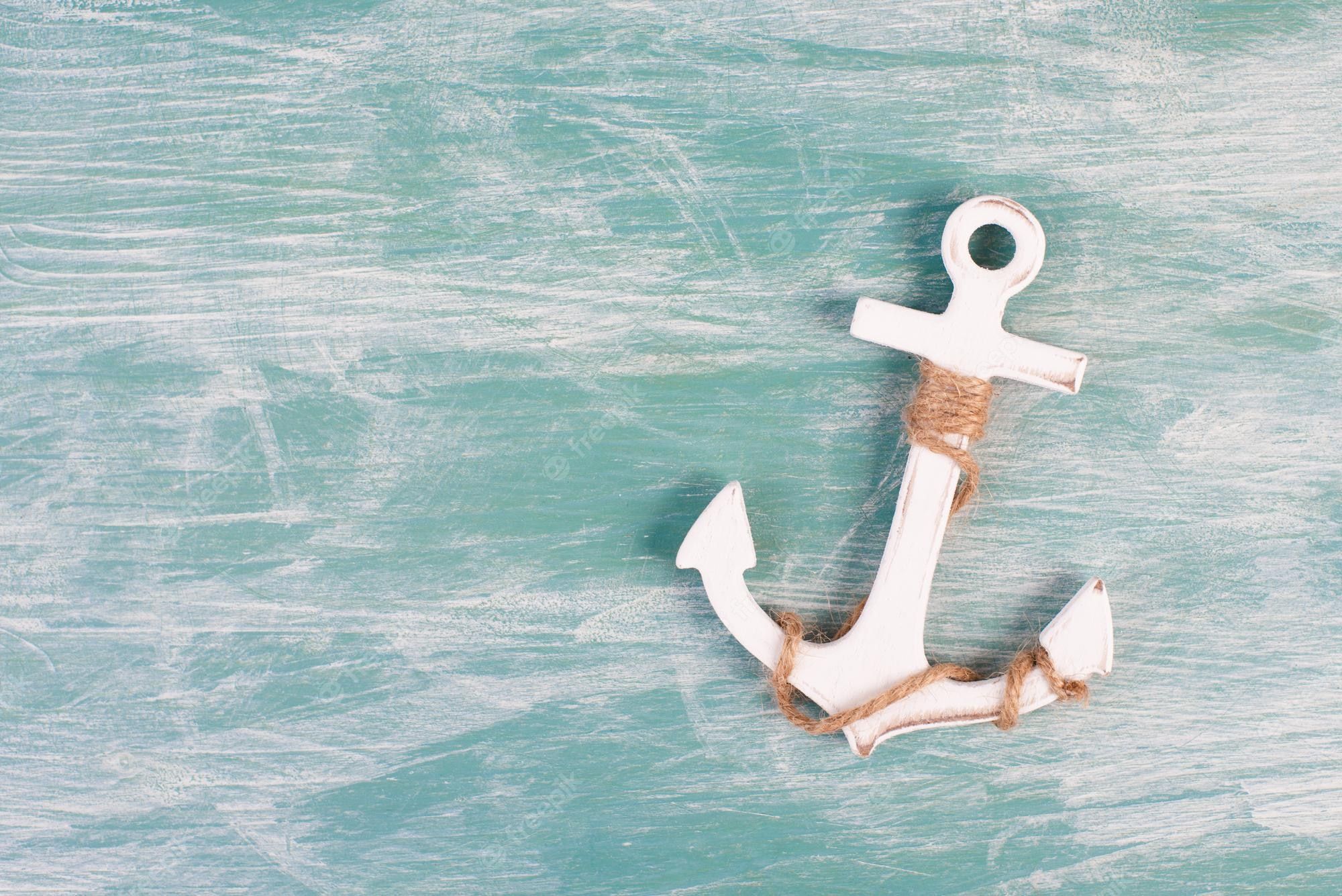 2000x1335 Premium Photo. White anchor on a blue textured background, maritime sea life, sailing trip, summer vacation