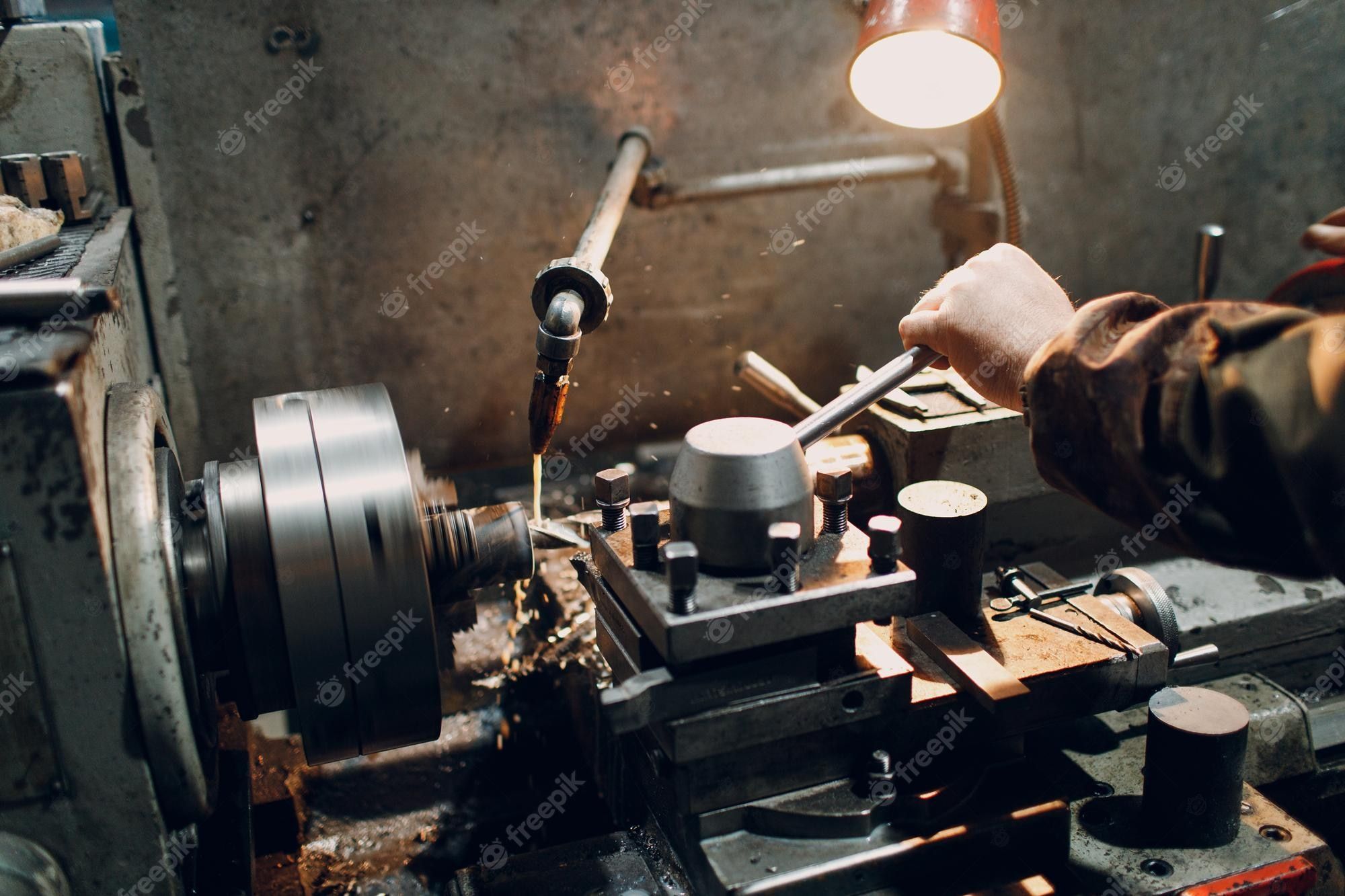 2000x1333 Premium Photo. Turner worker working on old lathe machine