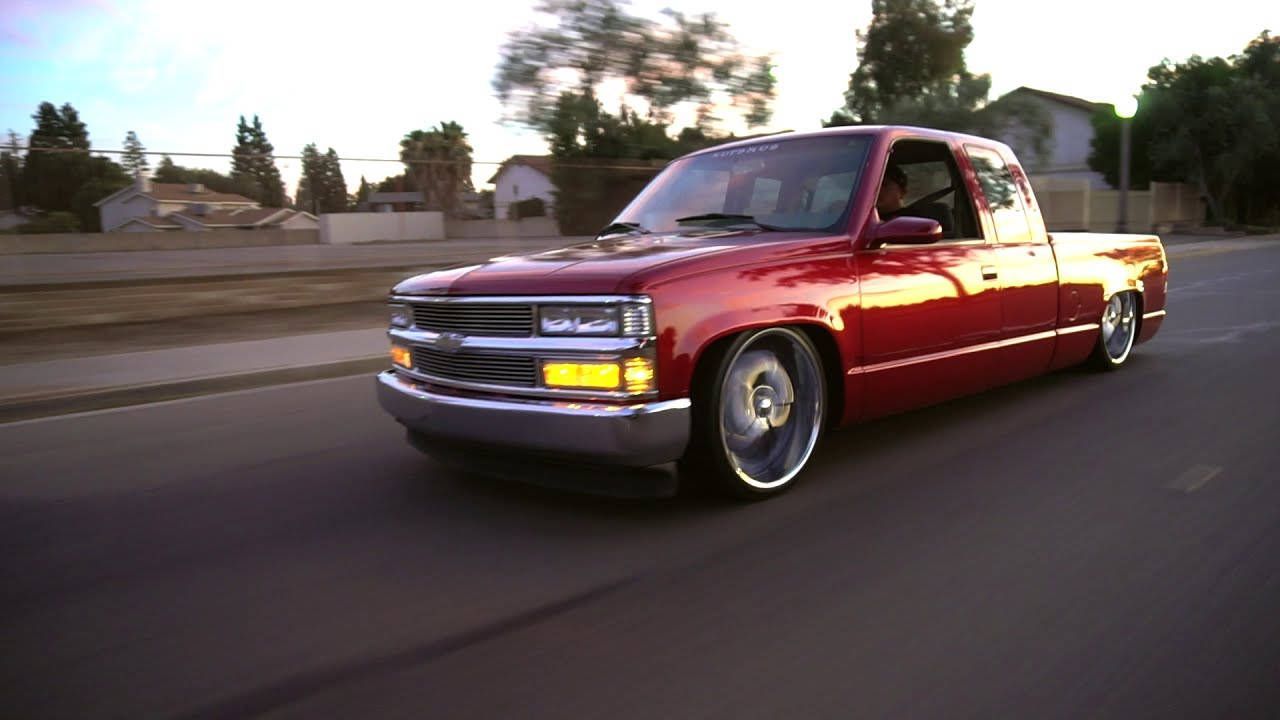 1280x720 Download Stunning Red Dropped Truck on Open Road. Wallpaper