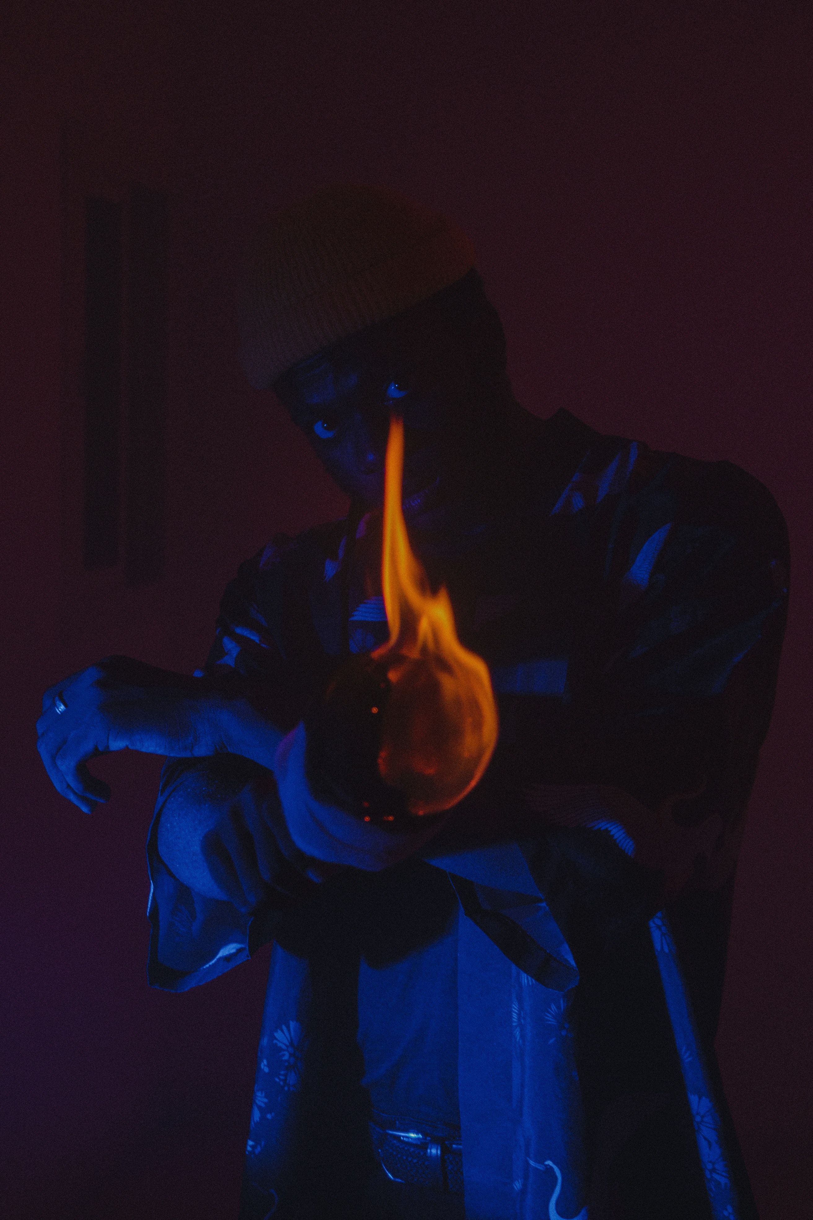 2624x3936 A Man Kneeling on the Ground while Holding a Torch · Free