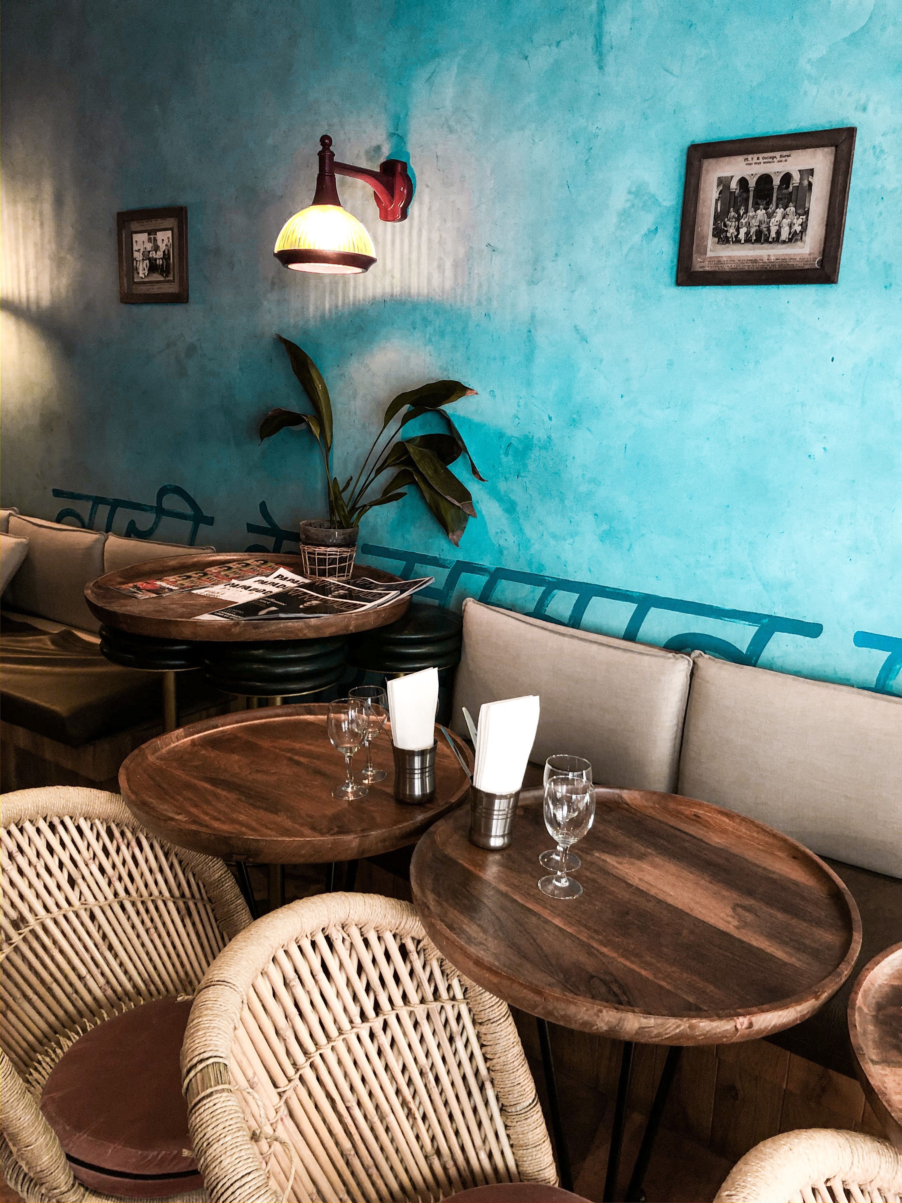 3024x4032 Cozy cafe with wooden tables and wicker chairs · Free