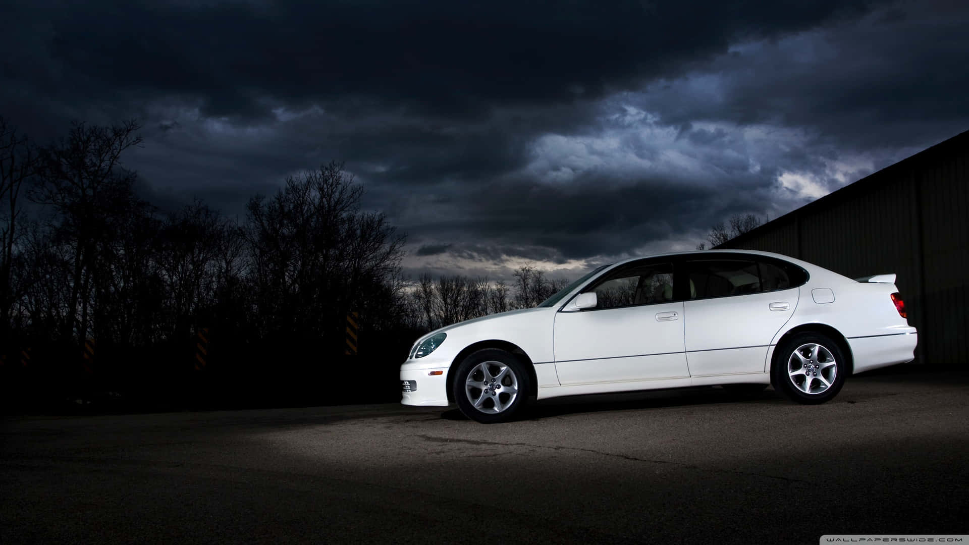 1920x1080 Download Caption: Sleek and Luxurious Lexus GS Cruising on the Road Wallpaper