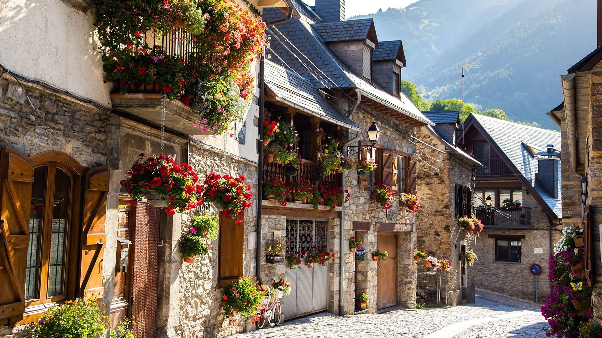 1920x1080 Vilac town in Val d'Aran decorated with flowers during summer, Catalonia, Spain. Windows Spotlight Image