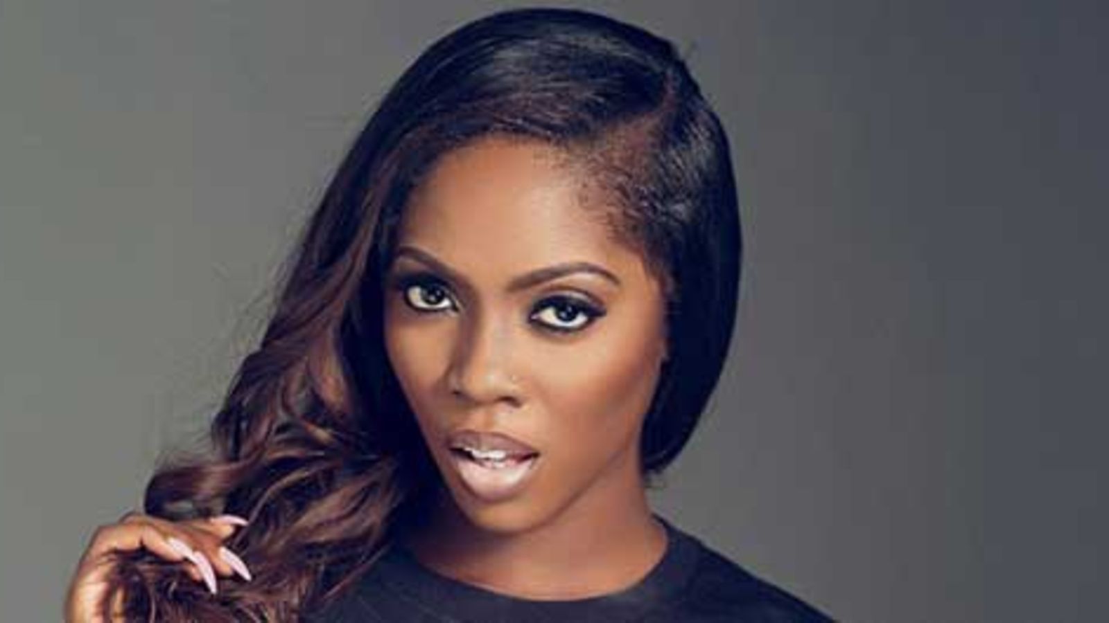 1600x900 Tiwa Savage mending fences