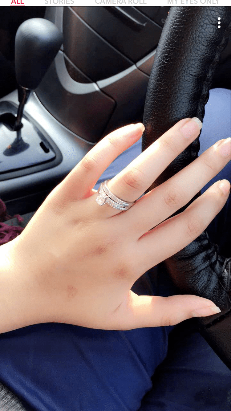 750x1334 Silver Ring On Girl Hand Wallpaper Download