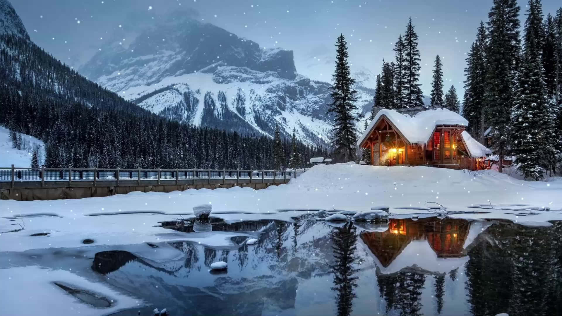 1920x1080 Download Cabin Covered In Snow By A Lake Wallpaper