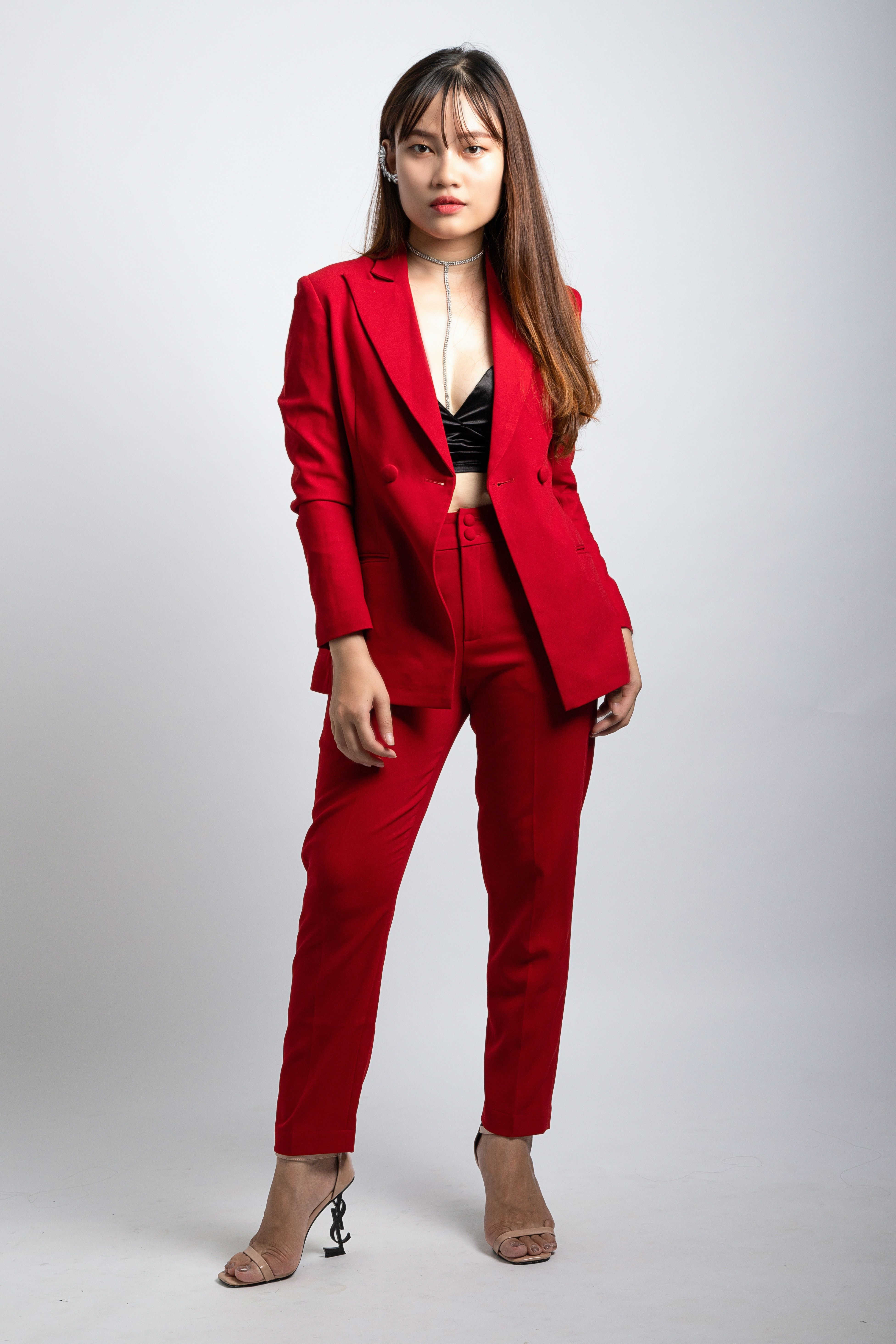 3905x5859 Woman Wearing Red Coat and Dress Pants Standing in Front of White Wallpaper · Free