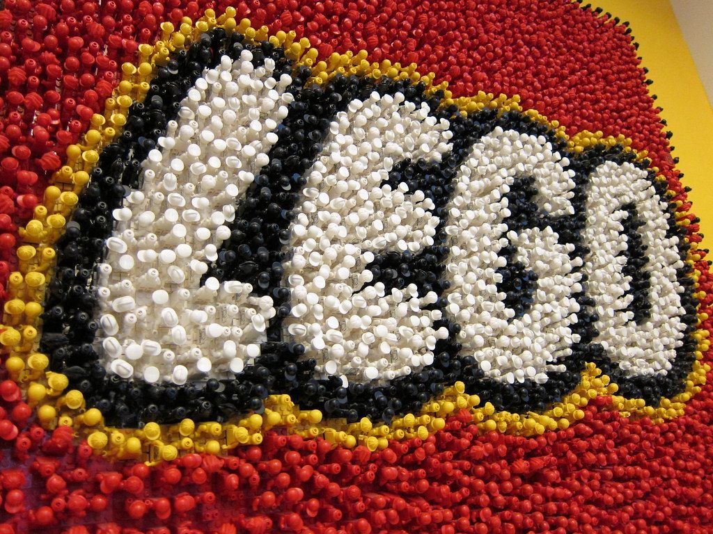 1024x768 Lego Logo (made out of Lego People!)