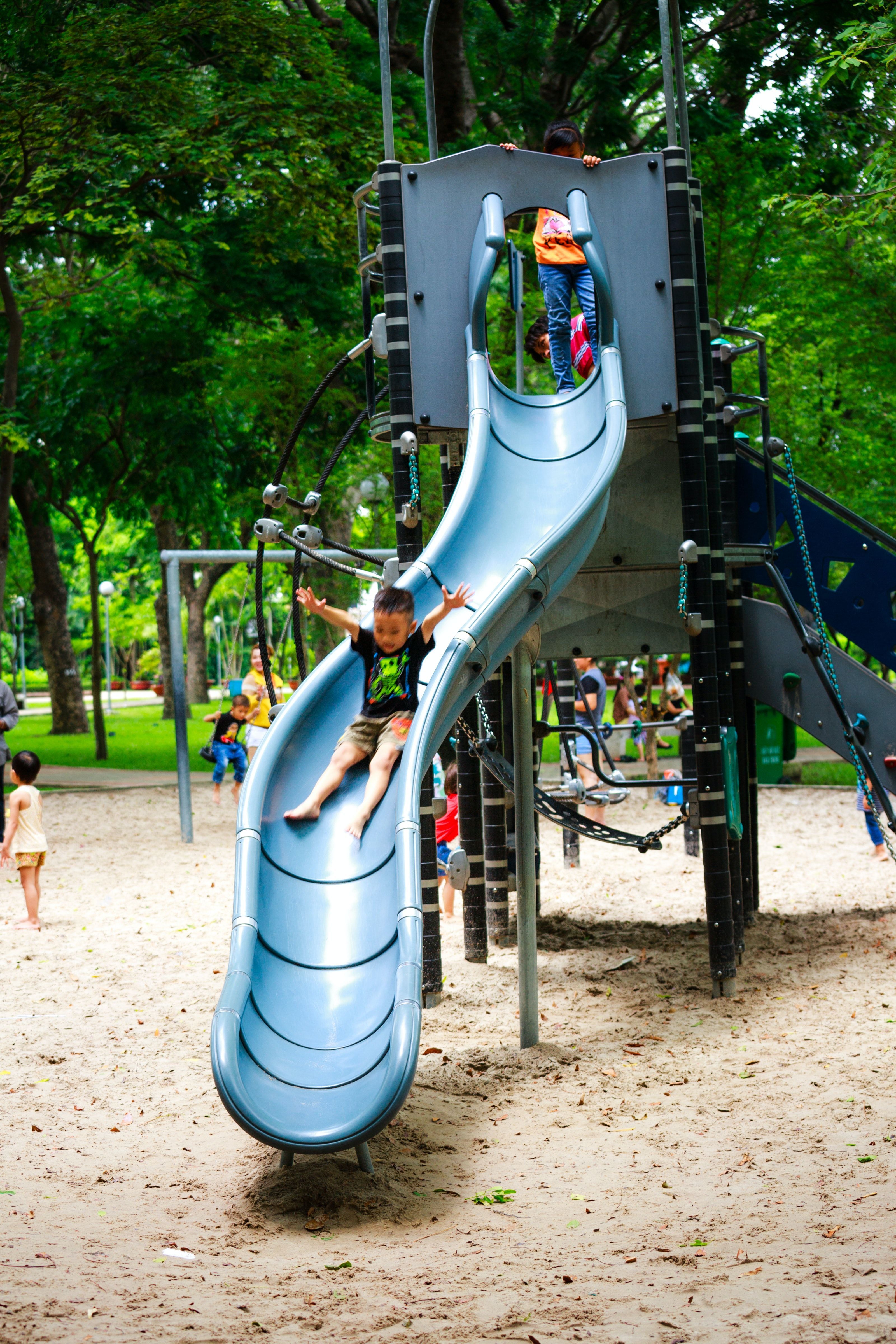 3200x4800 Boy Playing on Slide in Playground · Free