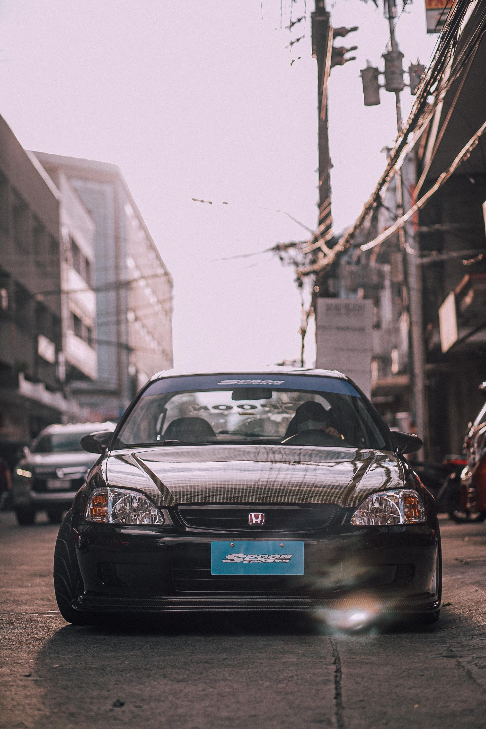 1999x2999 A Black Vintage Honda Civic CR X Parked In A Parking Lot · Free