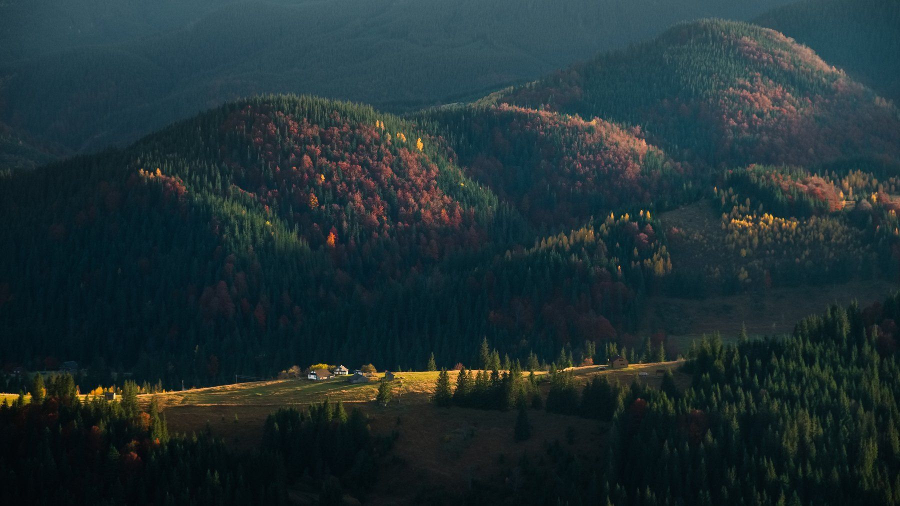 1800x1012 Dark shadow mountain landscape with light valley at sunset. Photographer Dmytro Gilitukha