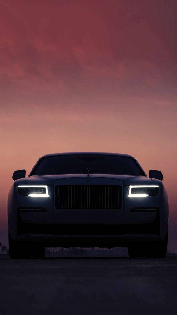 736x1308 Download Rolls Royce 4K Silhouette Under Sunset Wallpaper