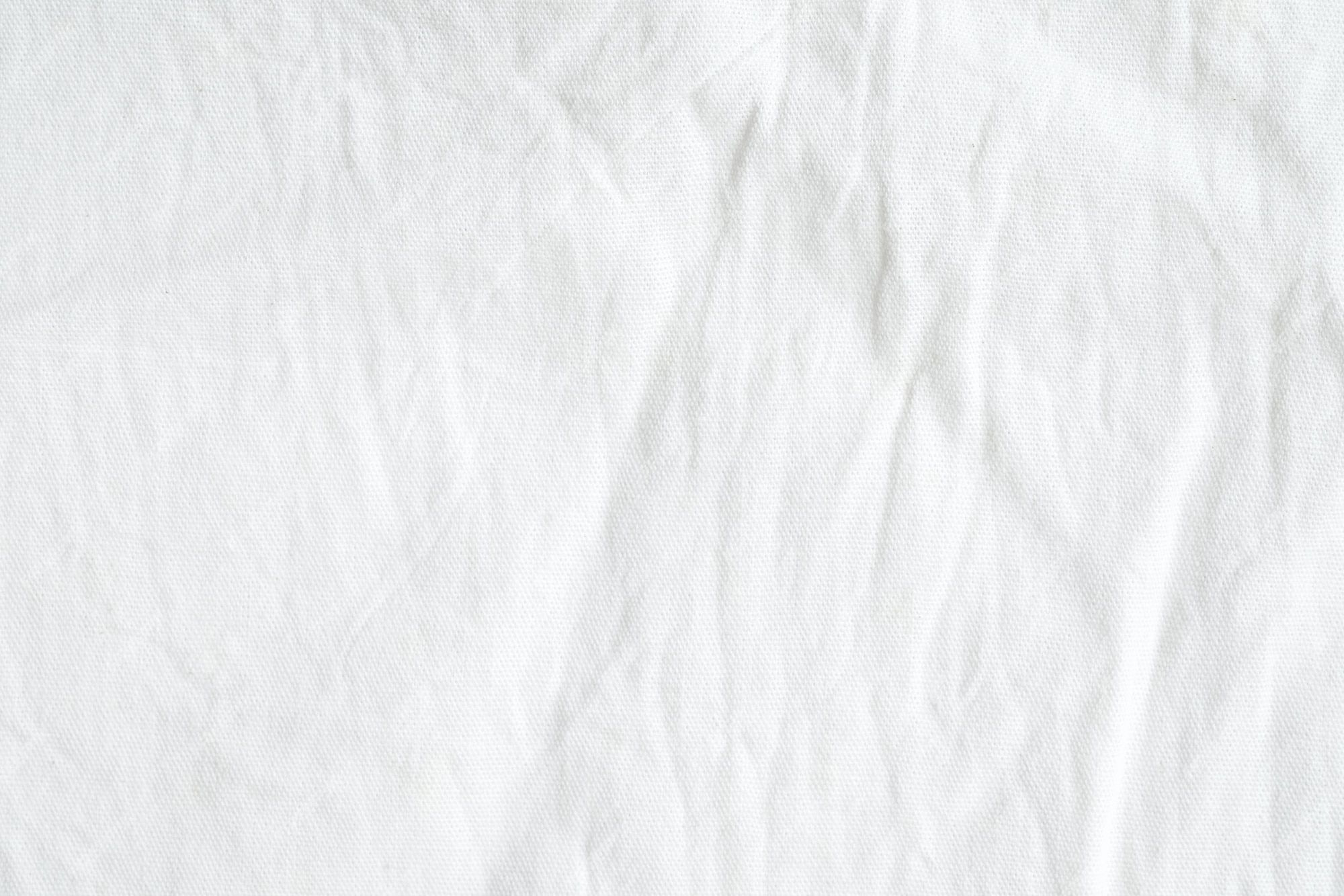 2000x1333 Premium Photo. Wrinkled white cotton canvas fabric textured background, wallpaper