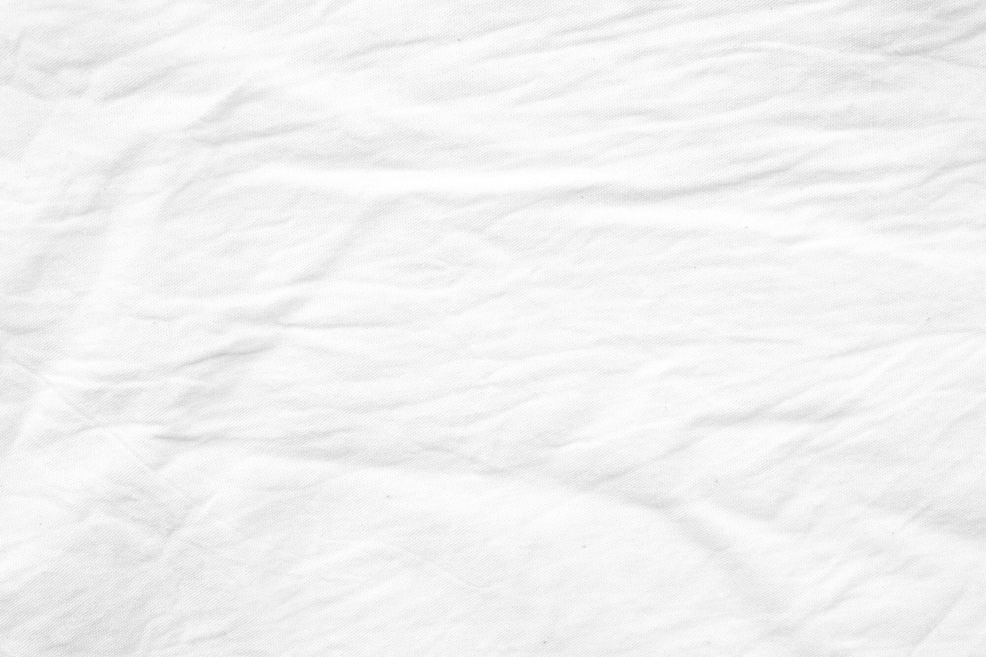 2000x1333 Premium Photo. Wrinkled white cotton canvas fabric textured background, wallpaper