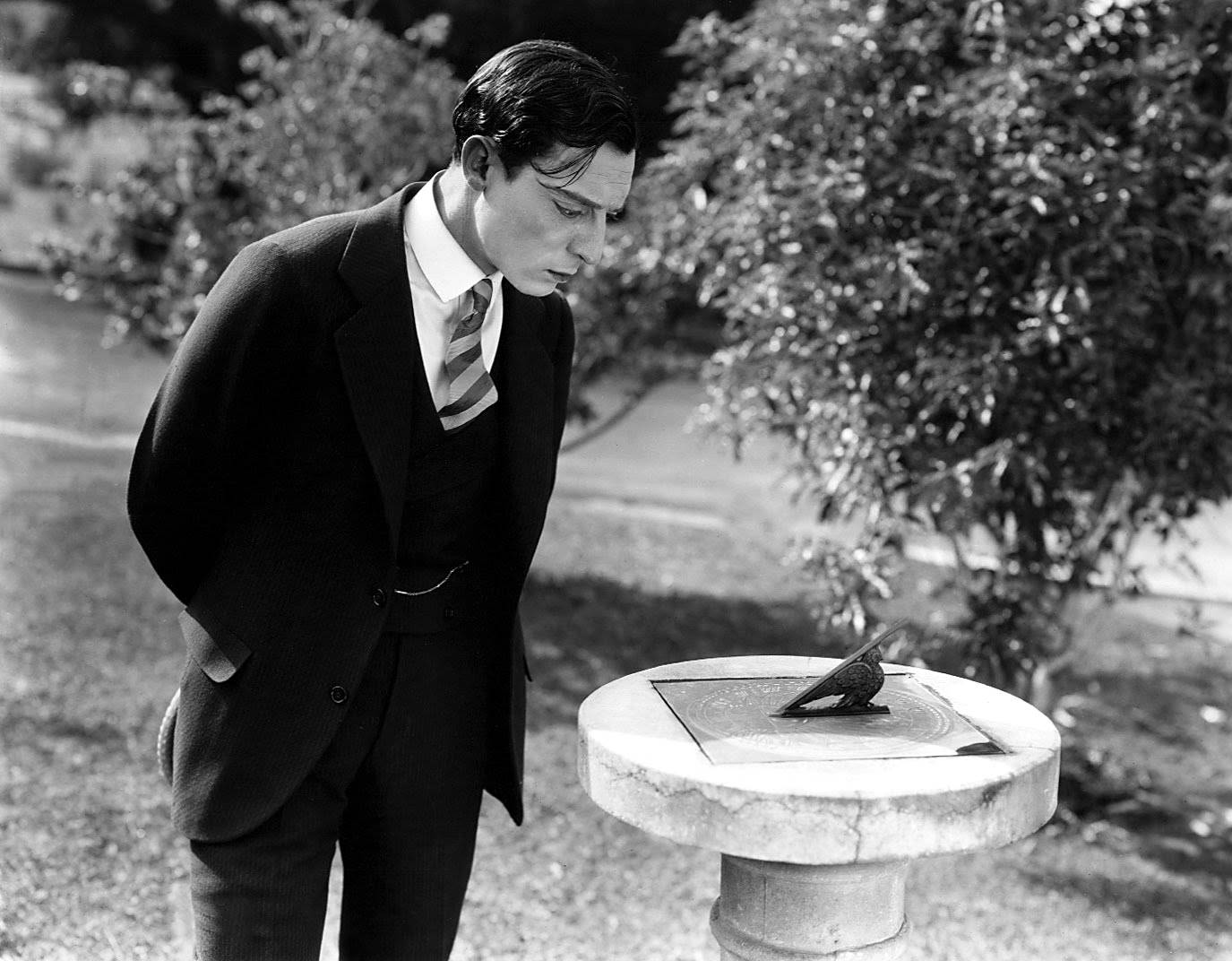1375x1072 Download Legendary Comedian Buster Keaton in Classic Suit Wallpaper