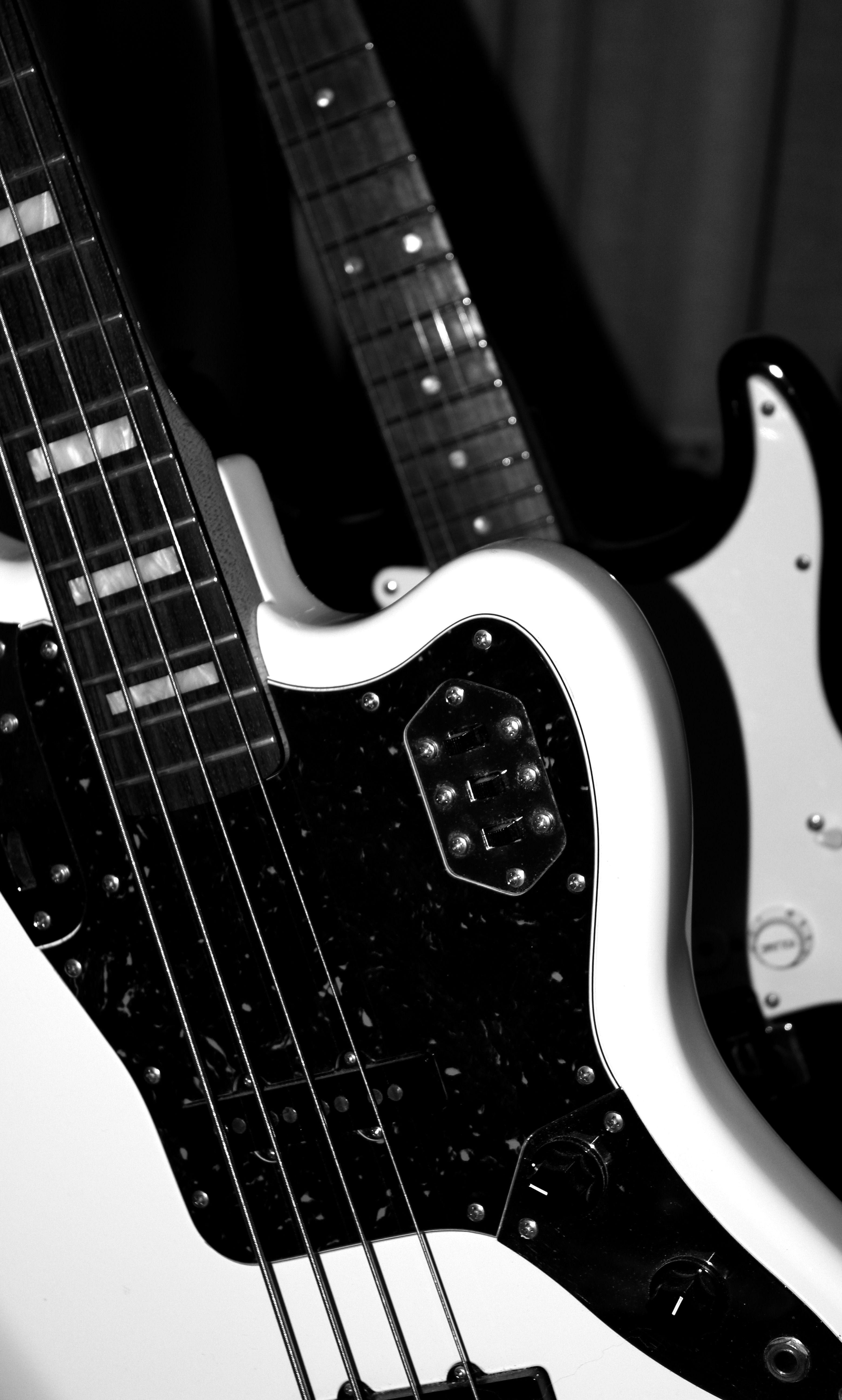 3120x5184 white black and silver 4 stringed electric bass guitar free image
