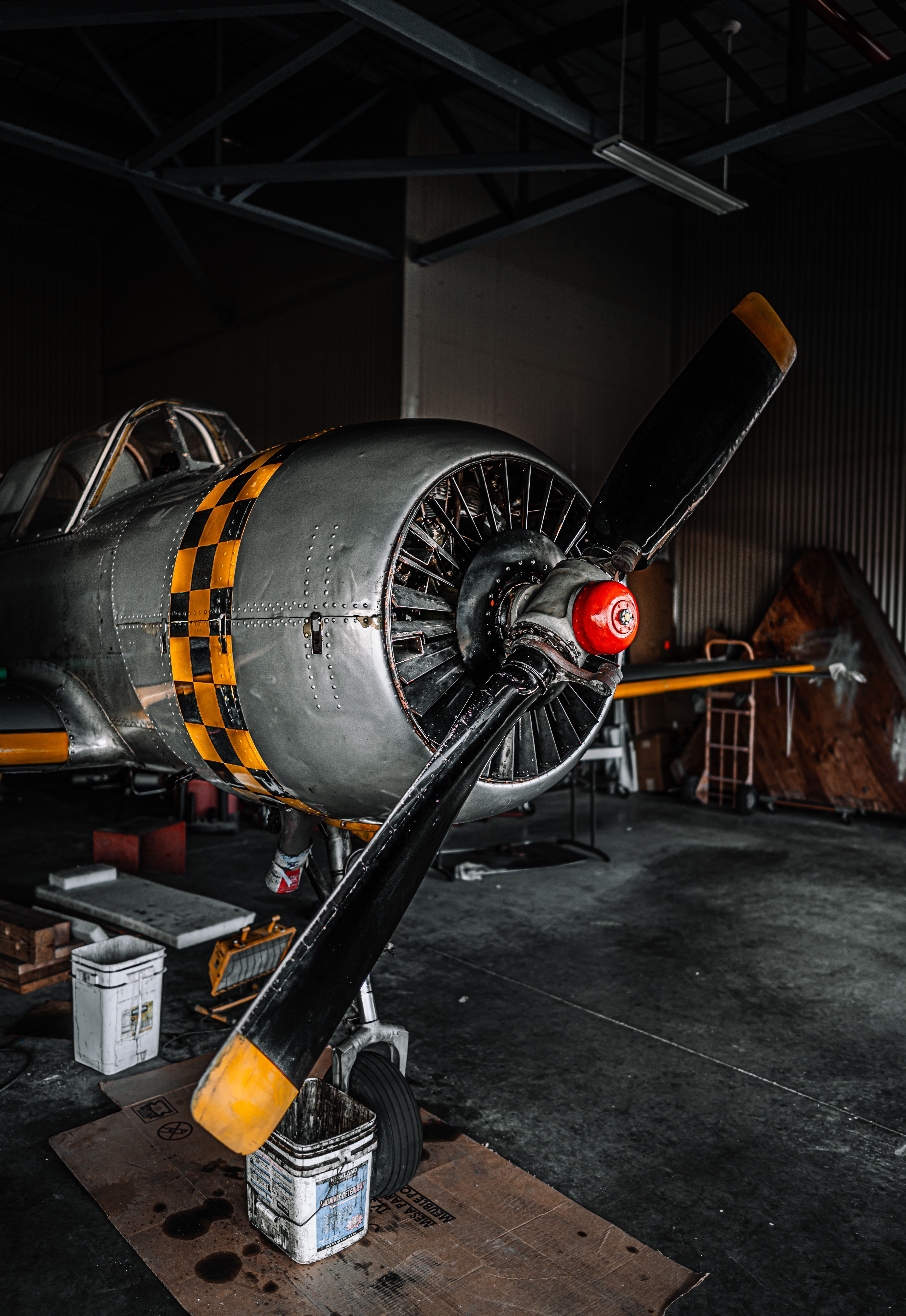 5473x7952 Fixed wing airplane parked in hangar for repairing · Free
