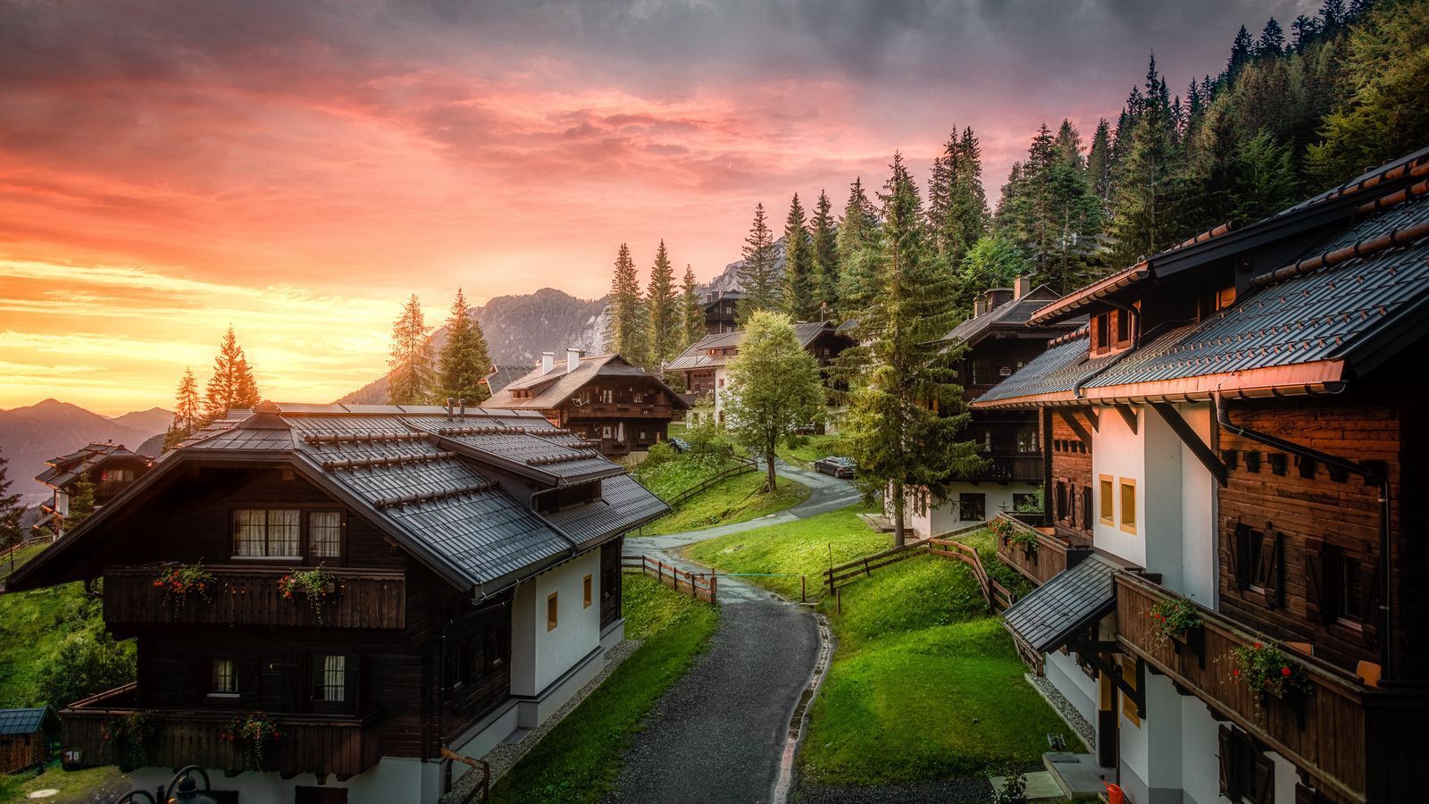 1600x900 Download wallpaper 1600x900 village, road, buildings, mountains, sunset widescreen 16:9 HD background