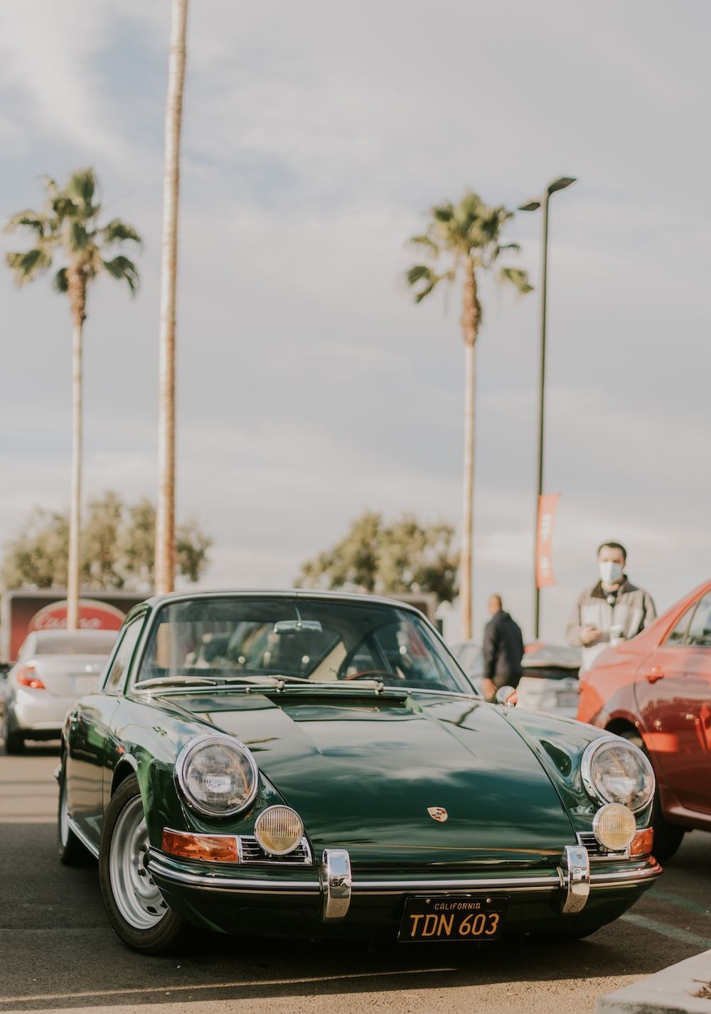 1000x1427 Green porsche 911 parked on street during daytime photo