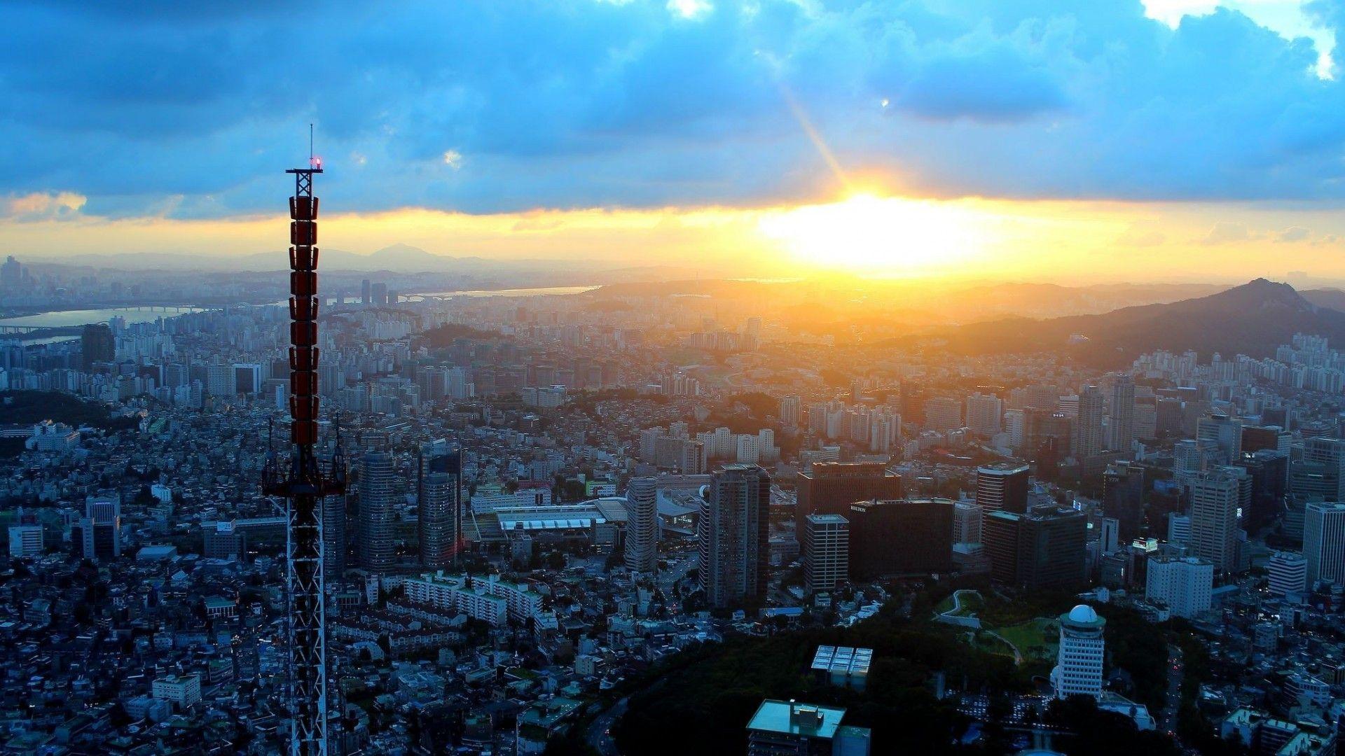 1920x1080 Sunsets: Rays Cities Buildings Asia Sunrise River Clouds Korea Hills
