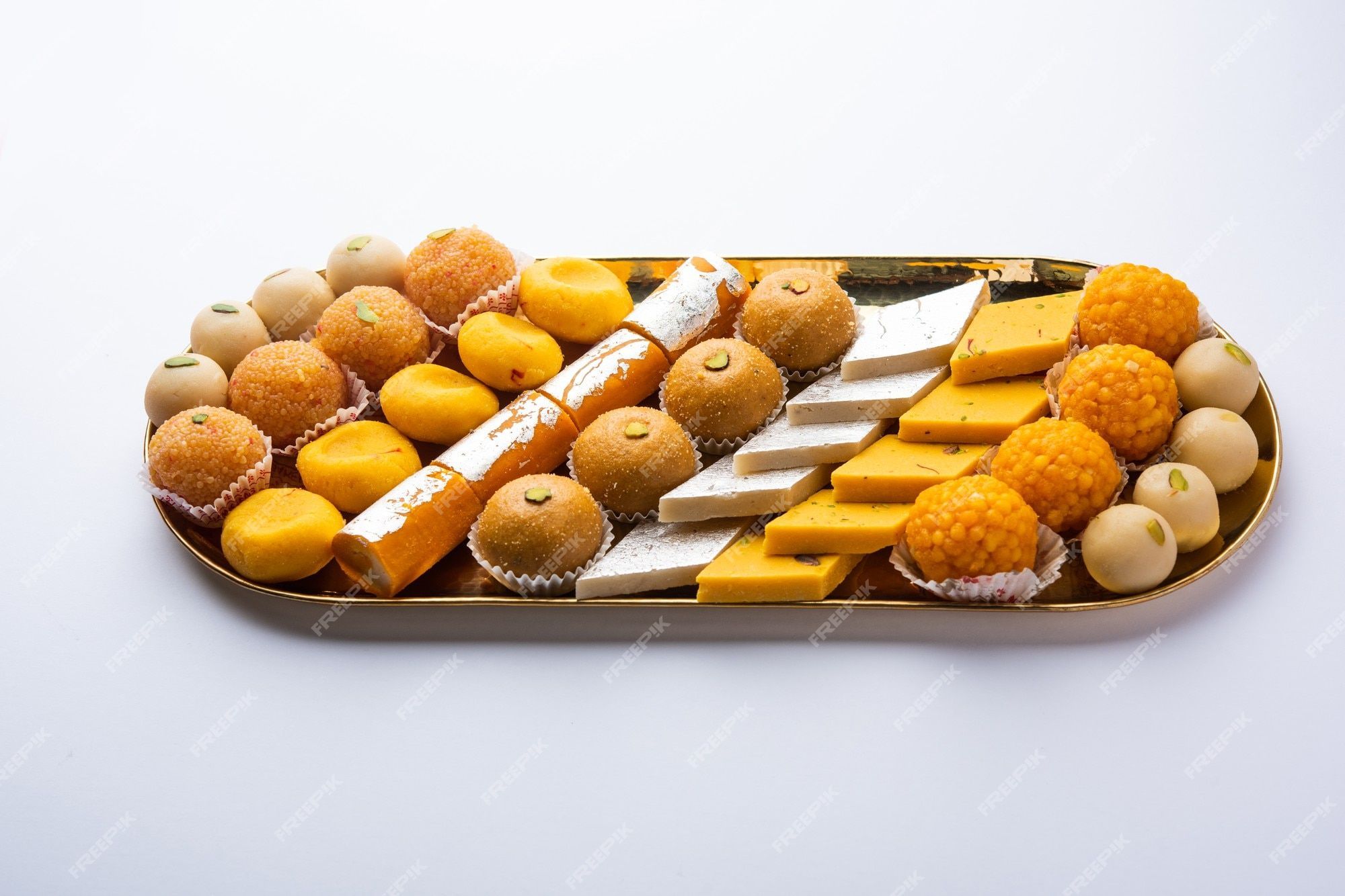 2000x1334 Premium Photo. Group of indian assorted sweets or mithai with diya
