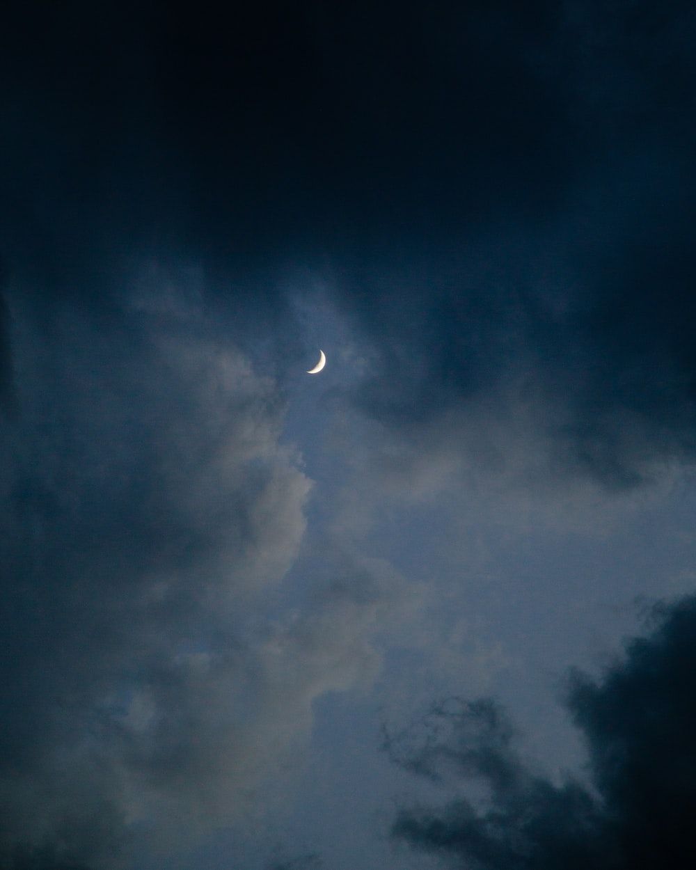 1000x1250 The moon is seenk clouds photo