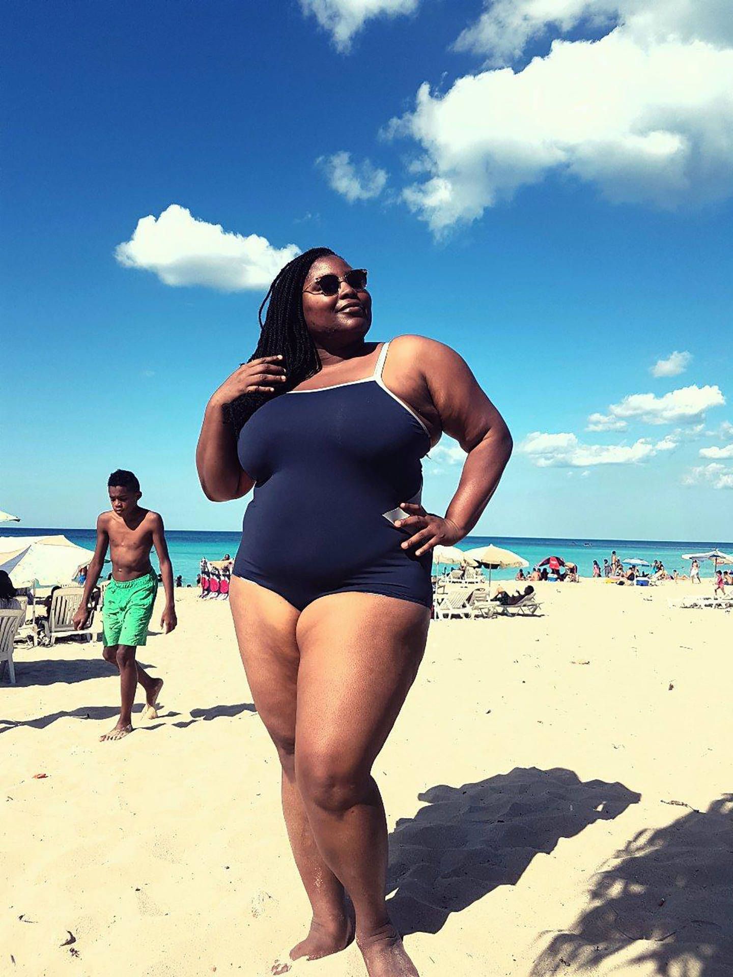 1440x1920 Download Confident Plus Sized Black Woman In Swimsuit Wallpaper