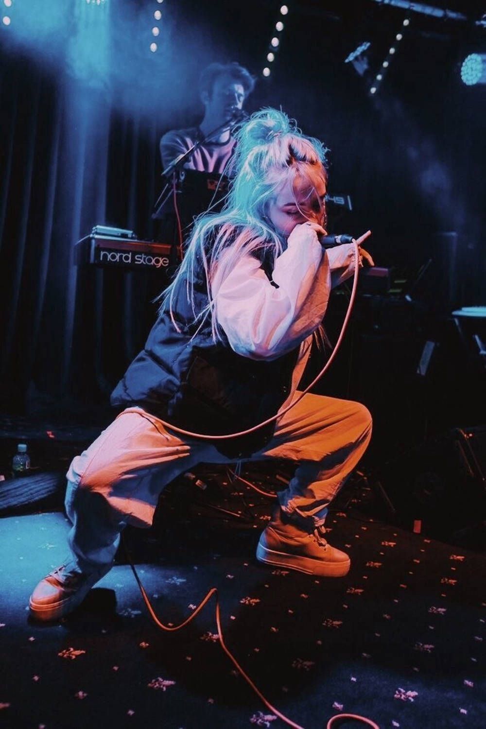 1000x1500 Download Aesthetic Billie Eilish Performing With Band Wallpaper