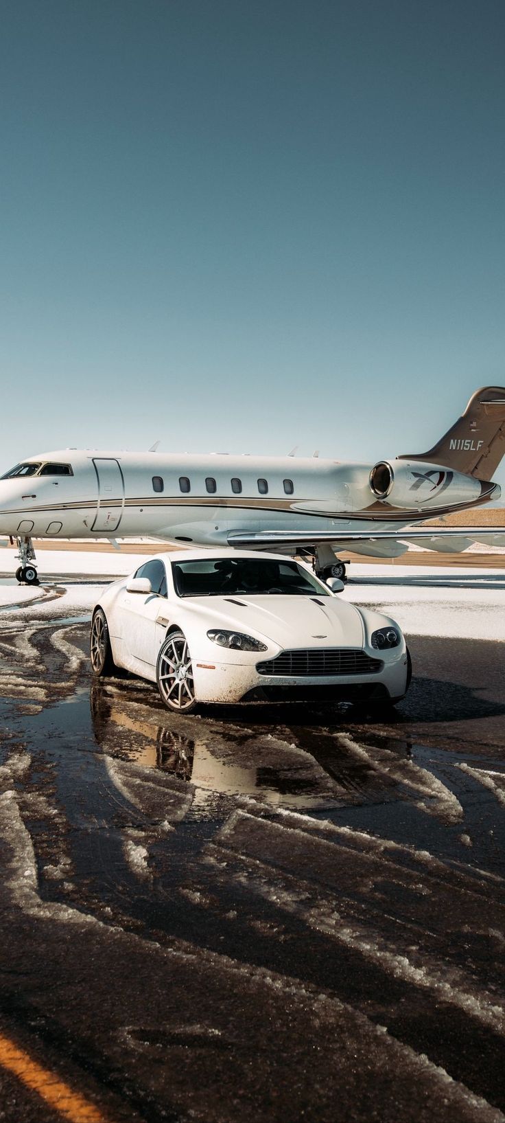 736x1635 Aston Martin Car parked in front of a Private Jet