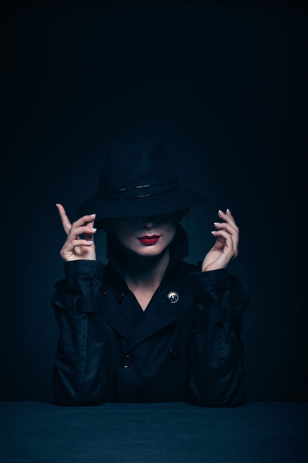 1000x1500 Woman in black coat and hat photo