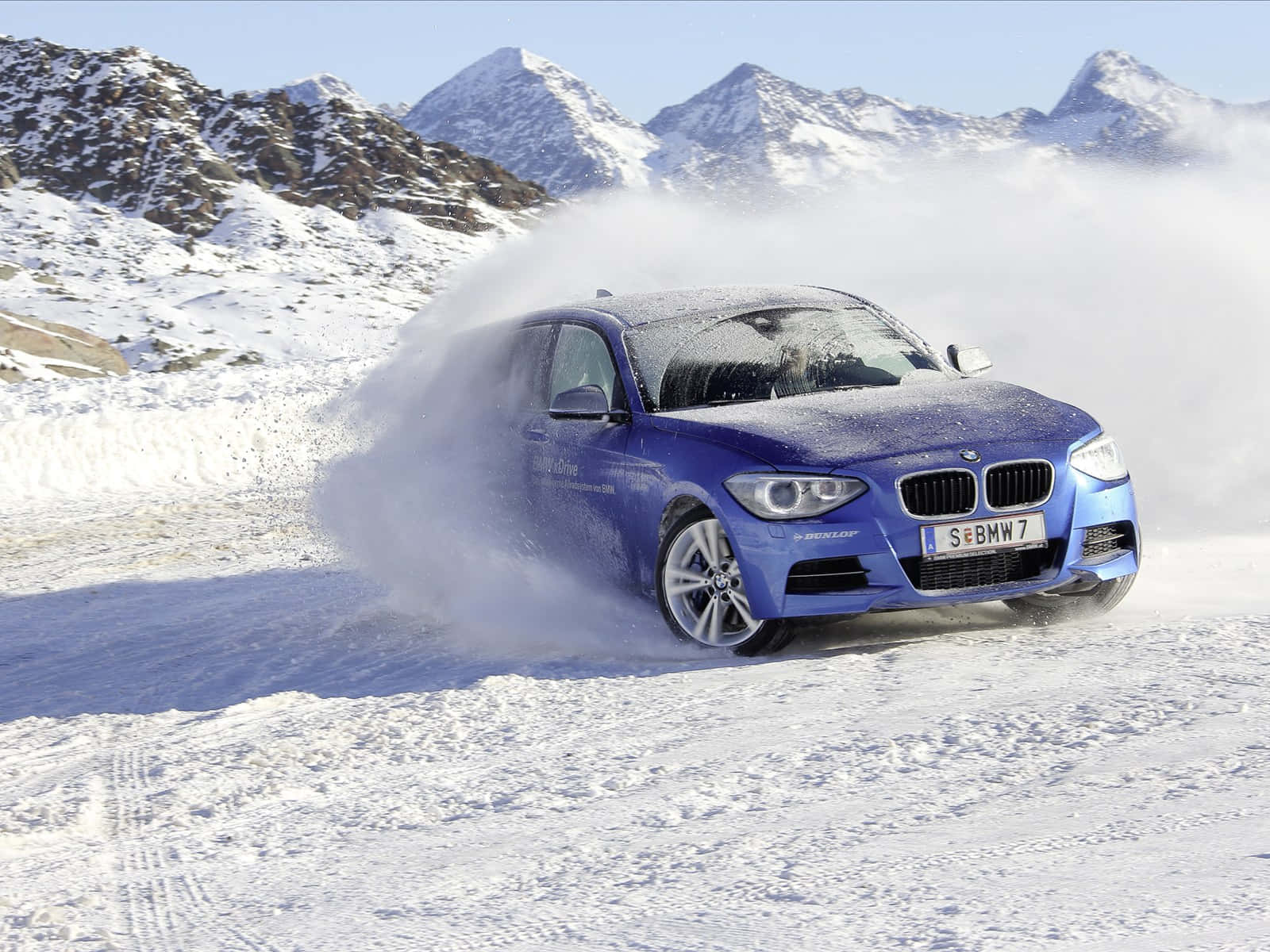 1600x1200 Download Sleek and stylish BMW 1 Series in a stunning outdoor setting. Wallpaper